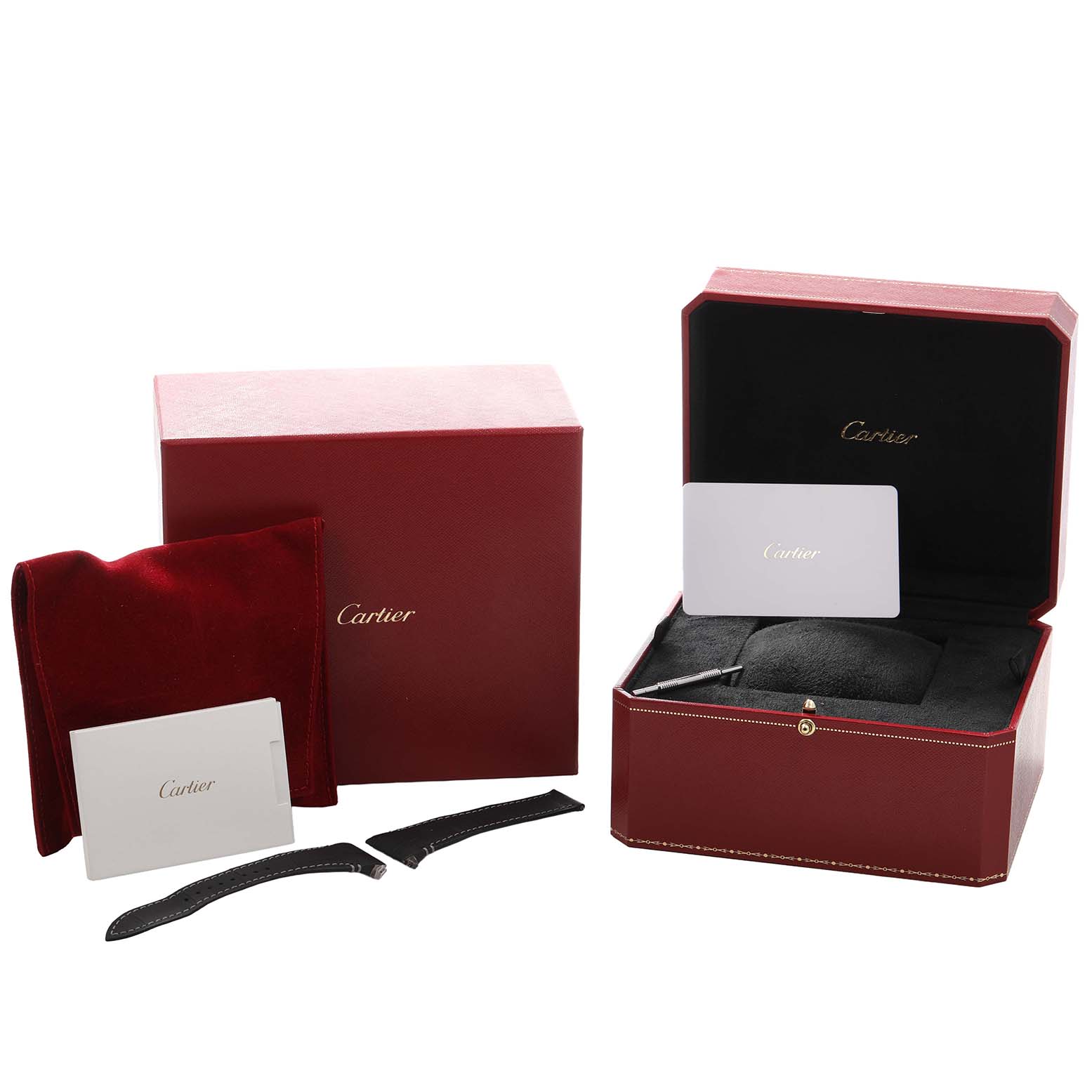 The image shows the Cartier Santos WSSA0017 Men's Stainless Steel Silver Dial watch box, additional straps, a case, and manuals from a top angle.
