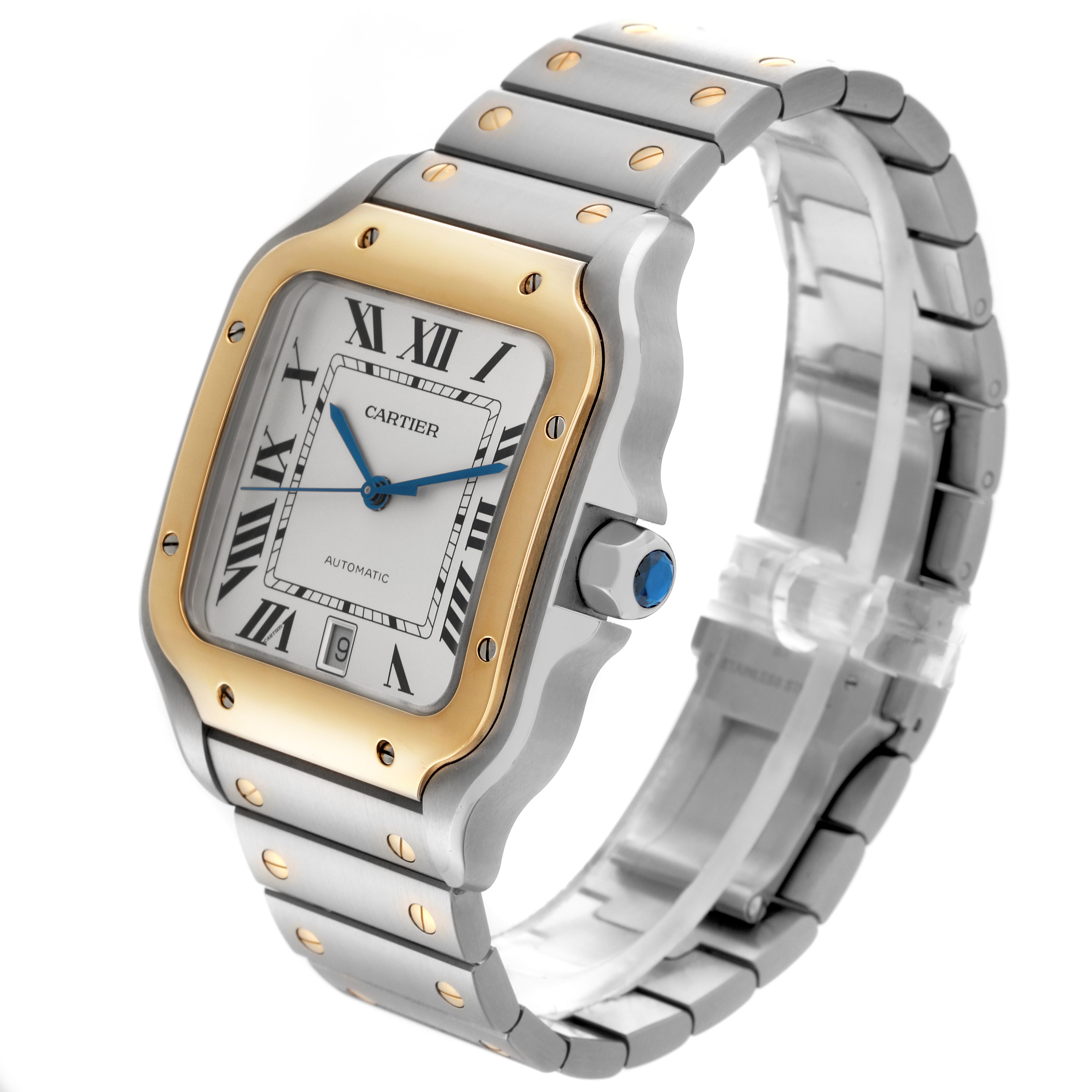 The Cartier Santos W2SA0009 Men's Steel and Gold (two tone) Silver Dial W2SA0009 Men's Steel and Gold (two tone) Silver Dial watch is shown at a three-quarter angle, highlighting the bezel, dial, bracelet, and crown.