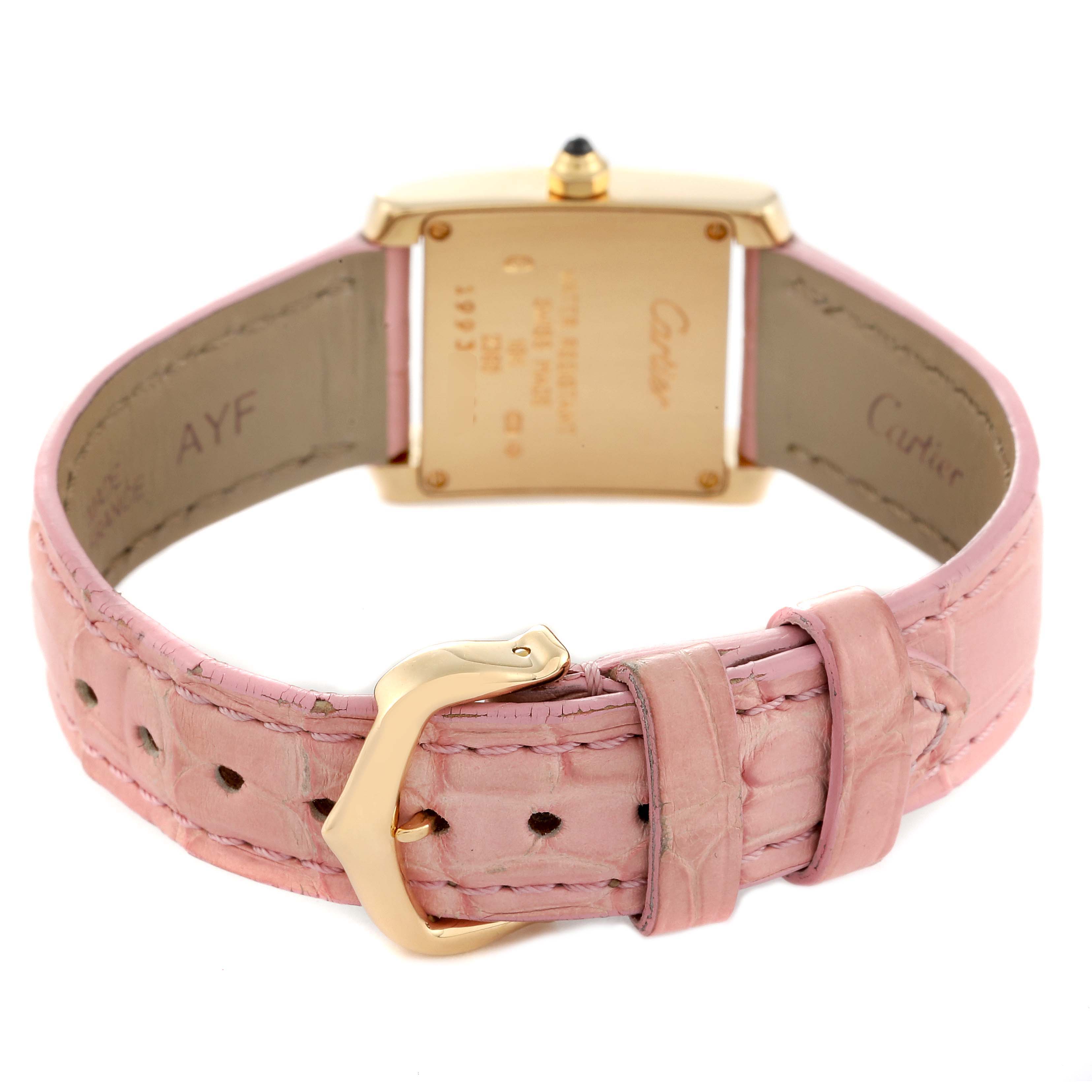 This image shows the back case and pink leather strap of the Cartier Tank Francaise W5000256 Women's Yellow Gold Silver Dial W5000256 Women's Yellow Gold Silver Dial watch from a rear angle.