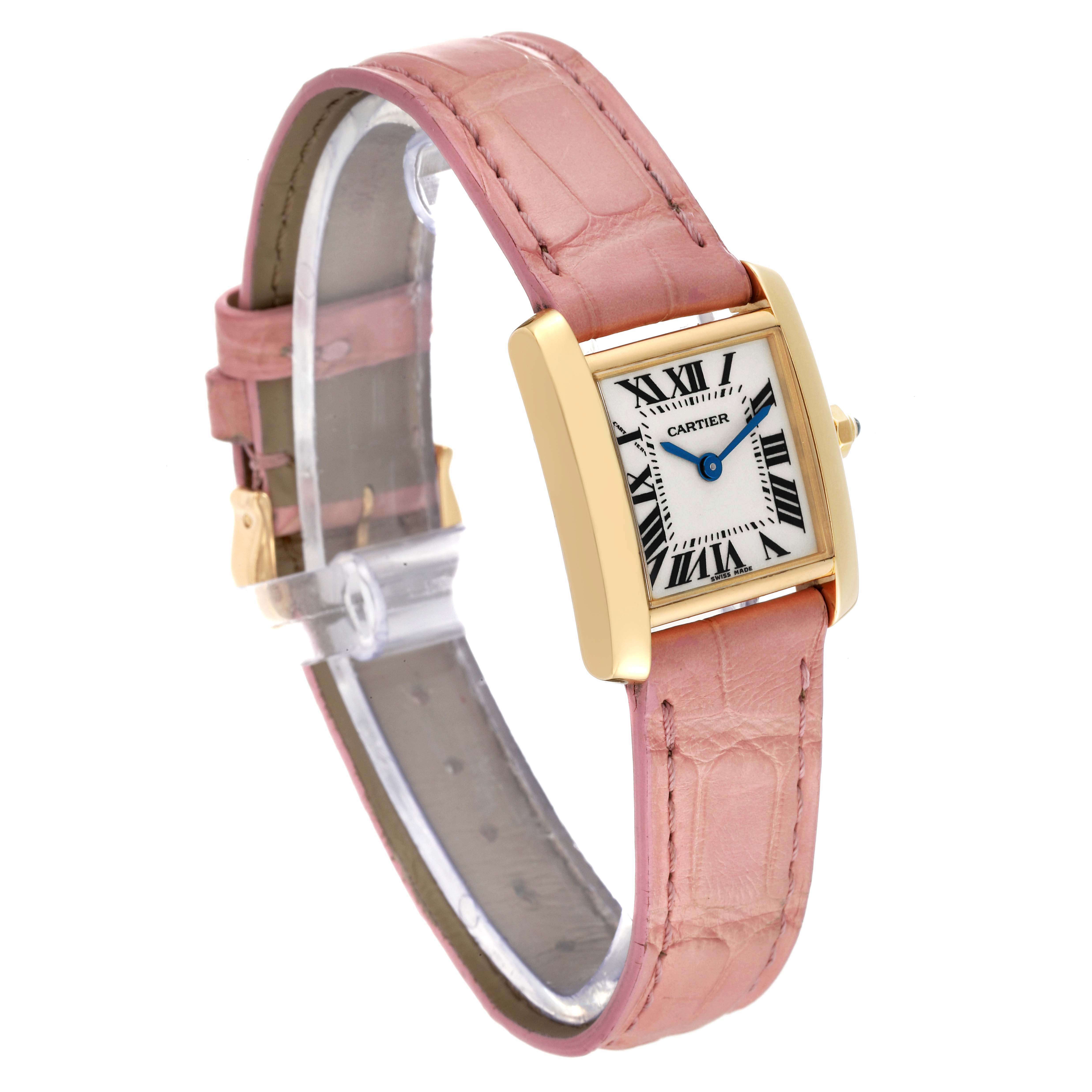 The Cartier Tank Francaise W5000256 Women's Yellow Gold Silver Dial W5000256 Women's Yellow Gold Silver Dial watch is shown at a three-quarter angle, highlighting the dial, case, and pink leather strap.