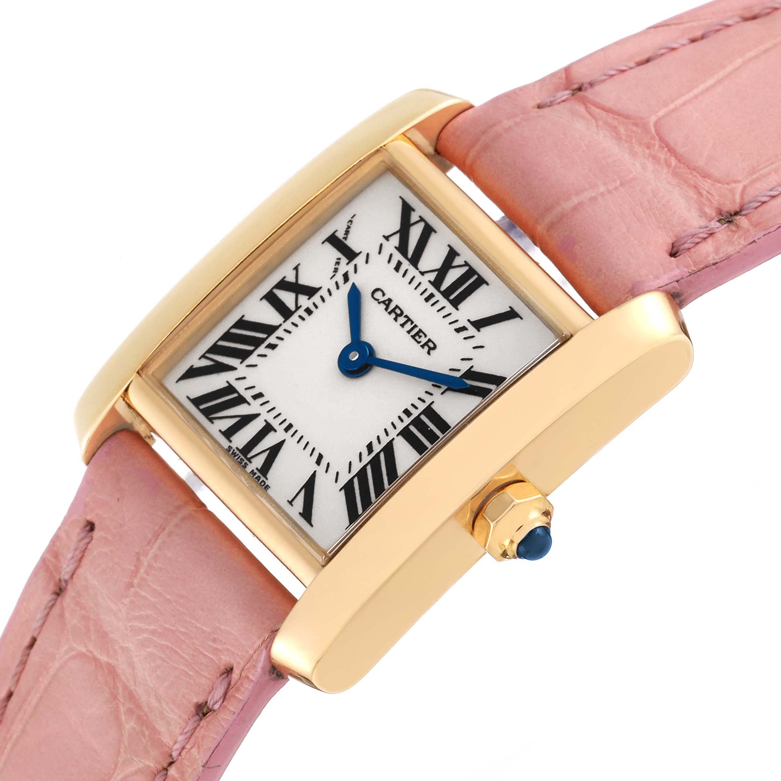 The Cartier Tank Francaise W5000256 Women's Yellow Gold Silver Dial W5000256 Women's Yellow Gold Silver Dial watch is shown at an angle highlighting its rectangular dial, gold case, pink leather strap, and blue hands.
