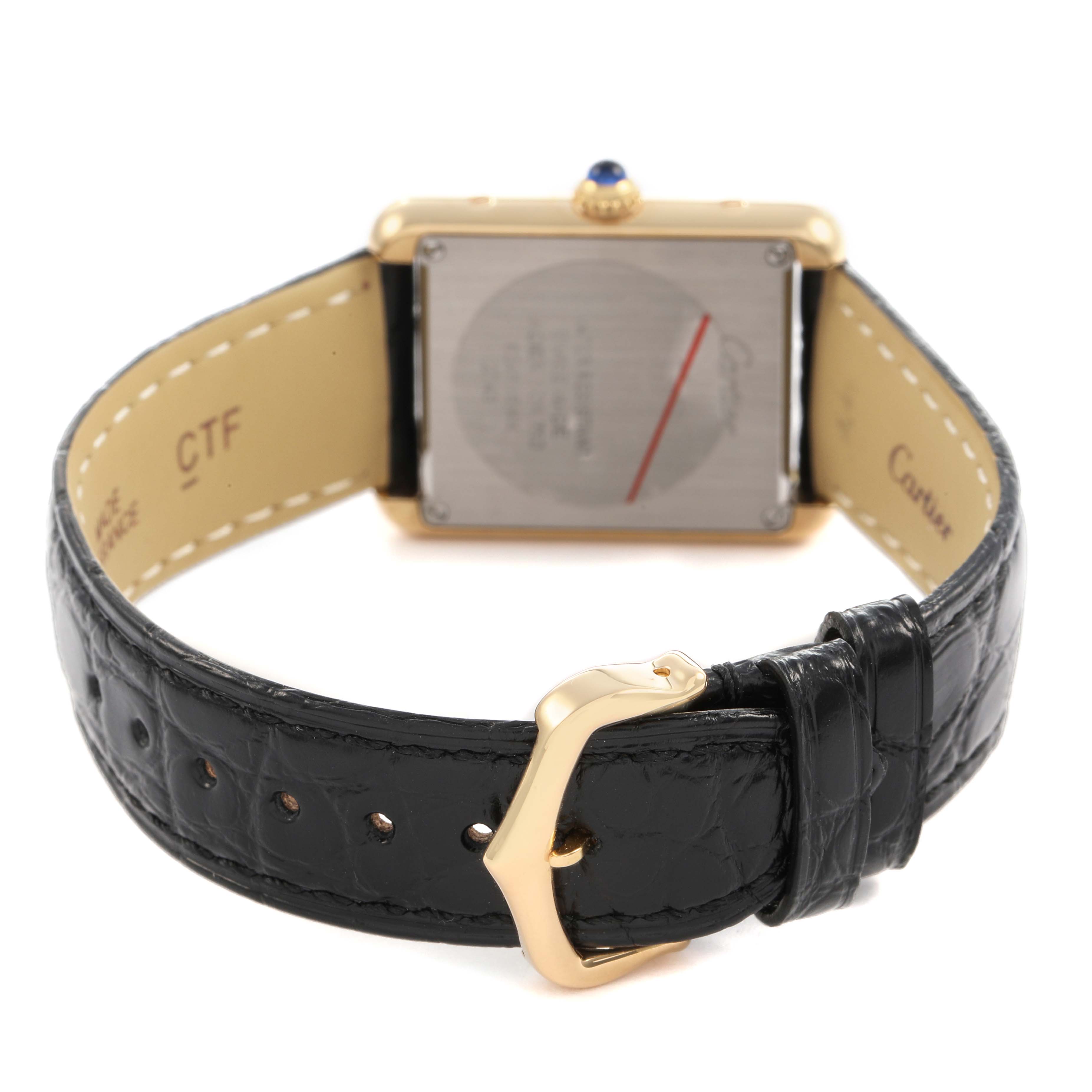 The image shows the back view of a Cartier Tank Solo W1018755 Women's Yellow Gold Silver Dial watch, highlighting the buckle, strap, and case back.