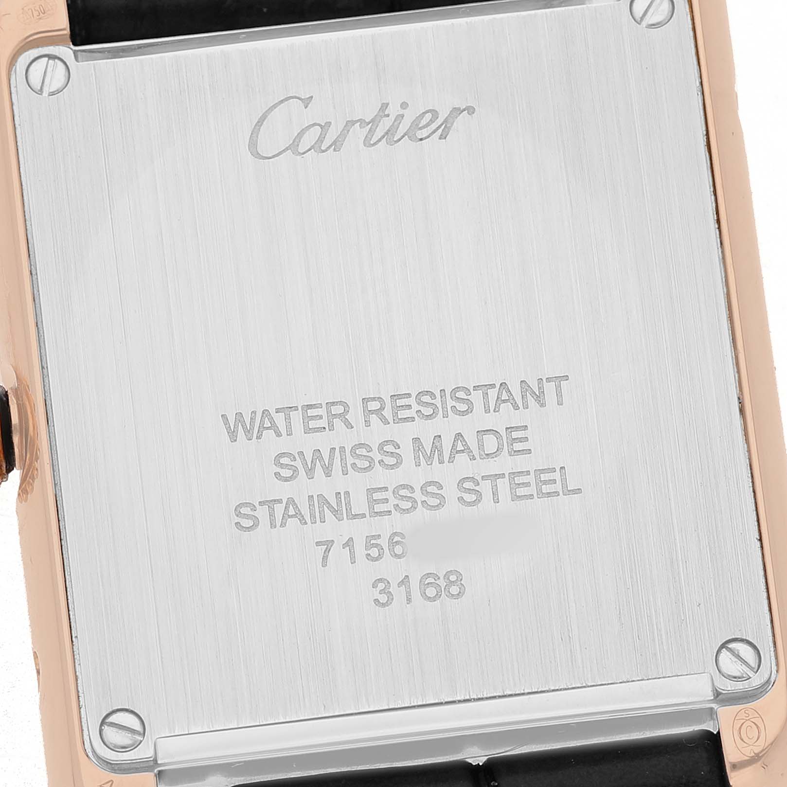 The image shows the back of a Cartier Tank Solo W5200002 Women's Steel and Gold (two tone) Silver Dial watch, highlighting its stainless steel case with engravings.