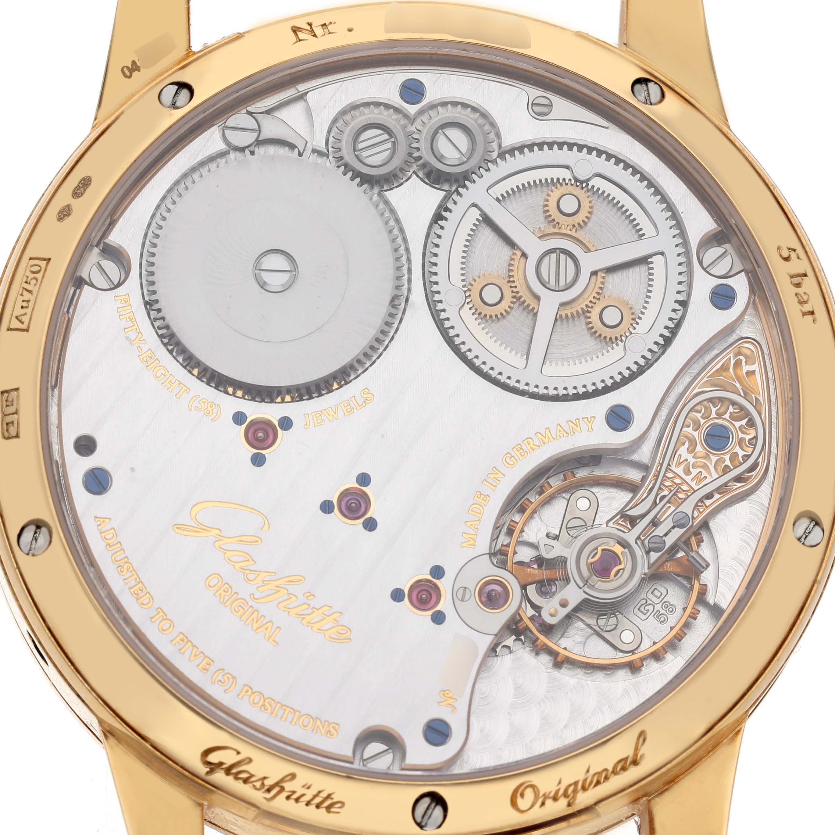 The image shows the back view of a Glashütte Senator watch, highlighting its intricate movement and gears.
