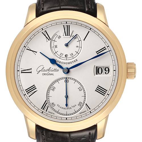 The Glashütte Senator watch is shown from a front angle, displaying its dial, Roman numerals, power reserve indicator, and date window.