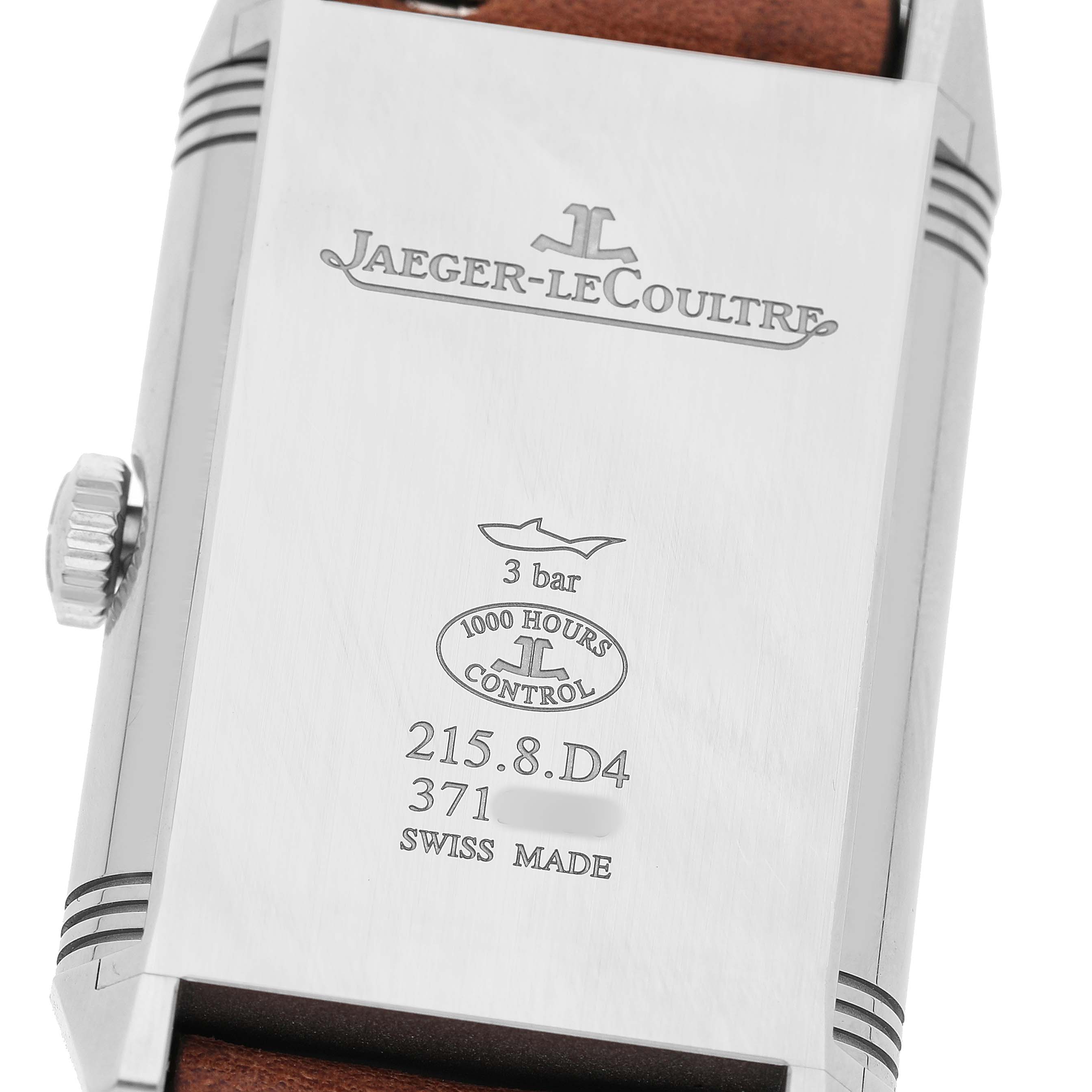 The image shows the back of the Jaeger-LeCoultre Reverso watch, featuring engravings and a side view of the crown.