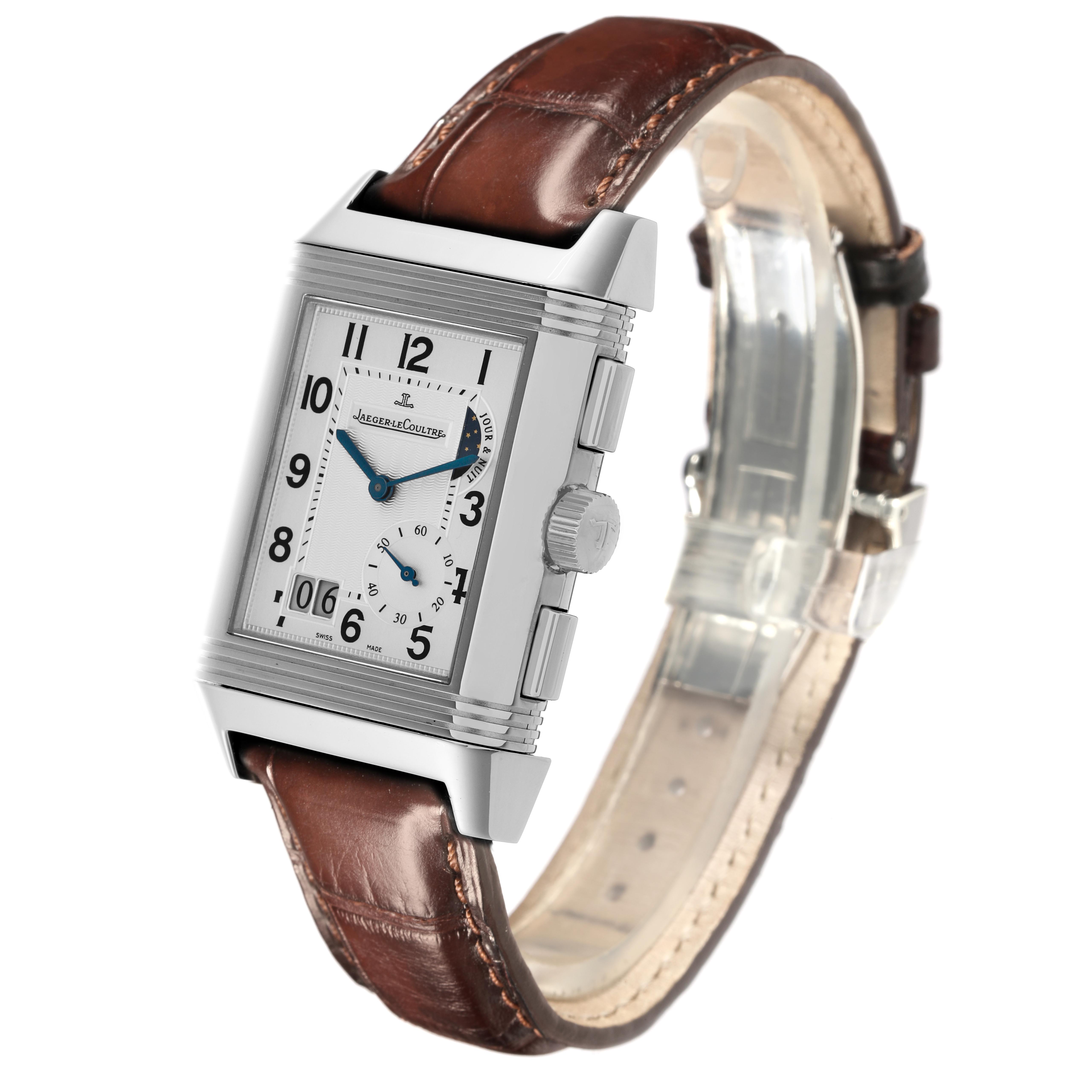 The Jaeger LeCoultre Reverso Q3028420 Men's Stainless Steel Silver Dial Q3028420 Men's Stainless Steel Silver Dial watch is shown at a slight angle, displaying its rectangular face, side buttons, and brown leather strap.
