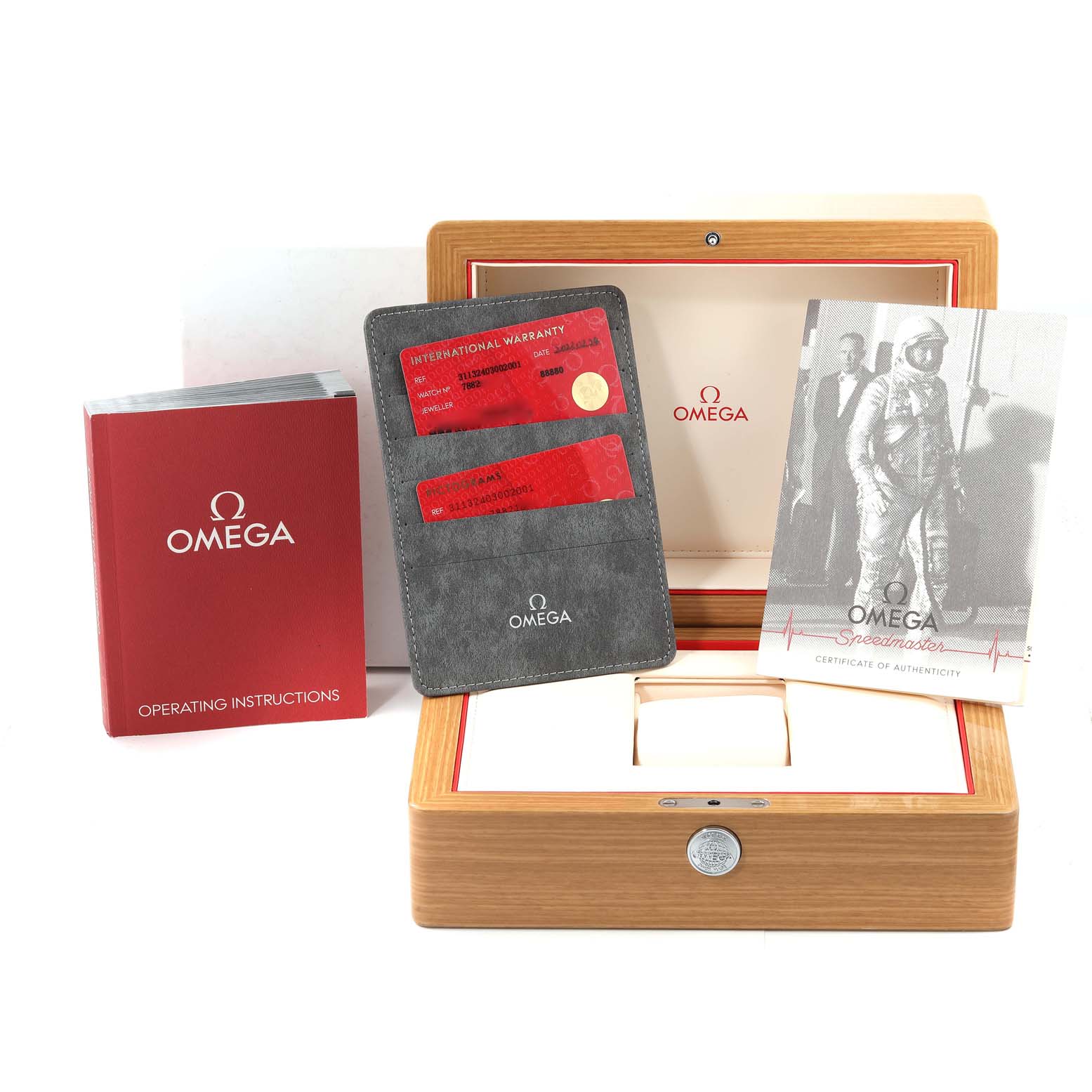 This image features the Omega Speedmaster 311.32.40.30.02.001 Men's Stainless Steel Silver Dial 311.32.40.30.02.001 Men's Stainless Steel Silver Dial's accessories, including the box, warranty card, operating instructions, and authenticity certificate.