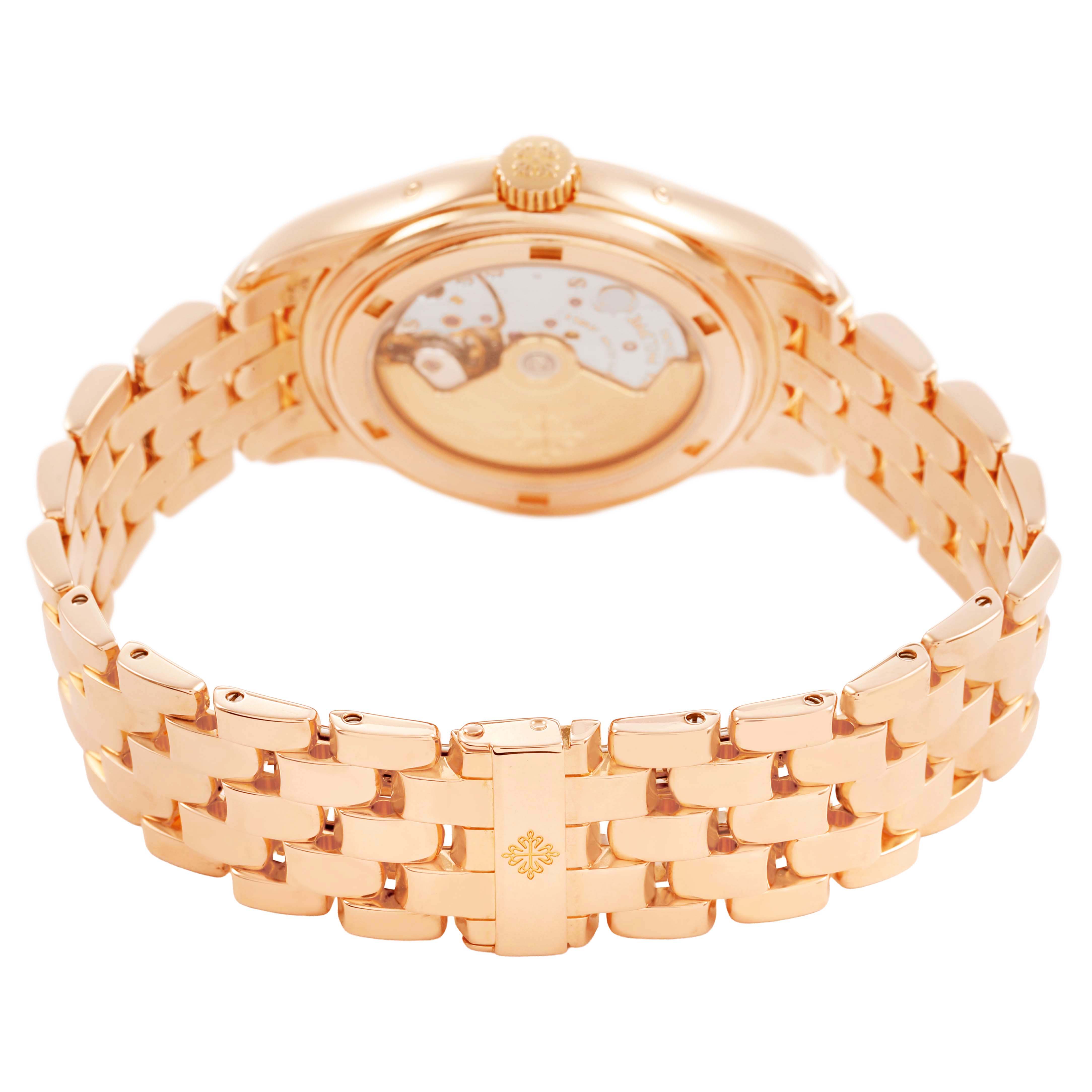 The Patek Philippe Complications 5036 Men's Rose Gold White Dial watch is shown from the back, highlighting the case back, crown, and bracelet.
