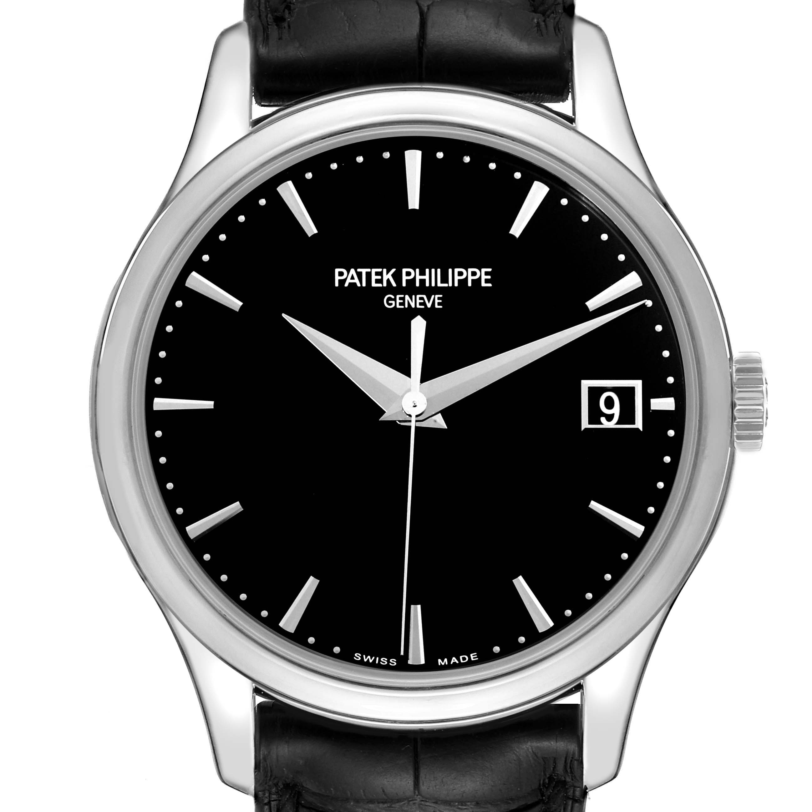 The image shows a front view of a Patek Philippe Calatrava 5227G Men's White Gold Black Dial 5227G Men's White Gold Black Dial watch, highlighting the dial, hands, hour markers, crown, and part of the strap.