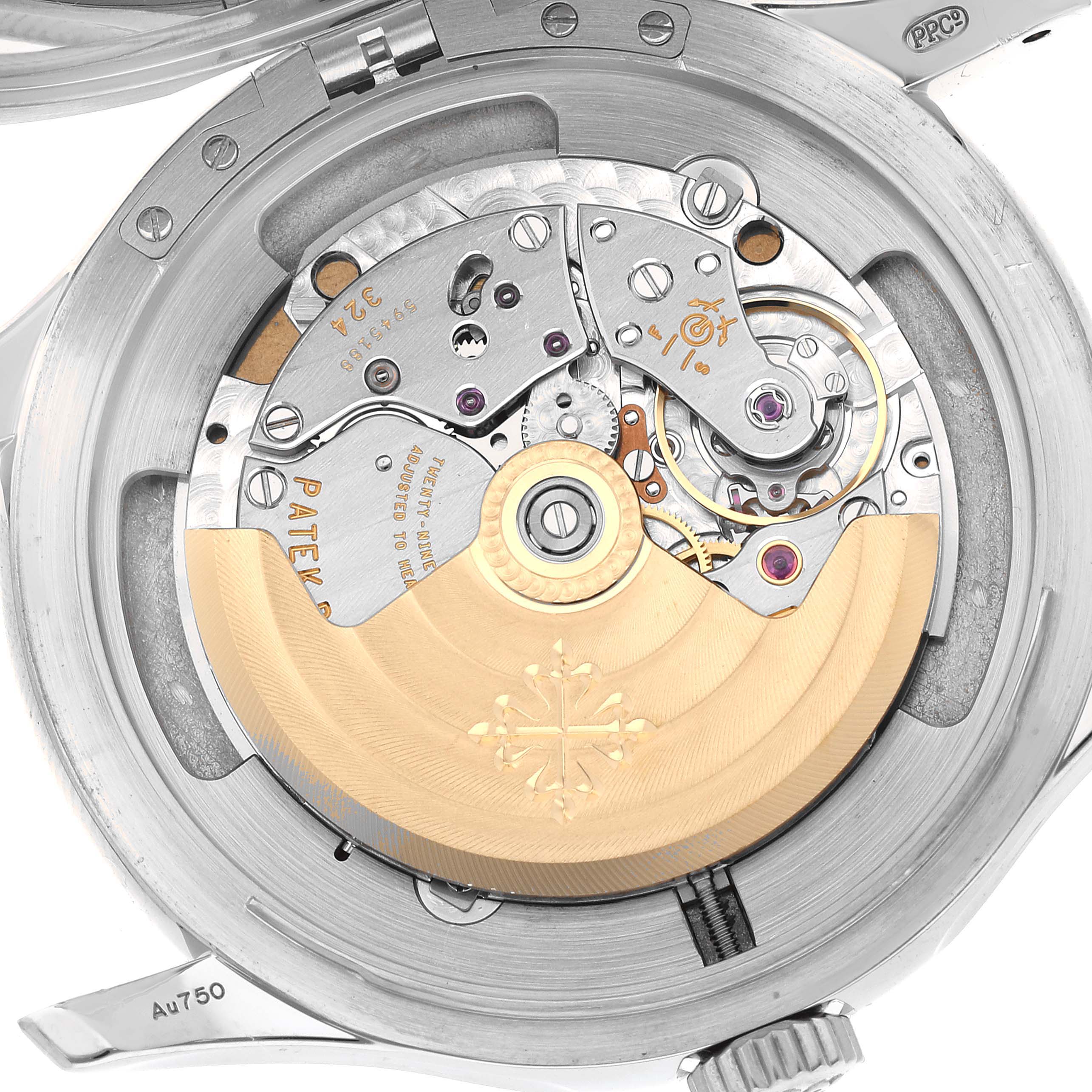 The image shows the intricate movement mechanism and rotor of a Patek Philippe Calatrava 5227G Men's White Gold Black Dial 5227G Men's White Gold Black Dial watch viewed from the back.