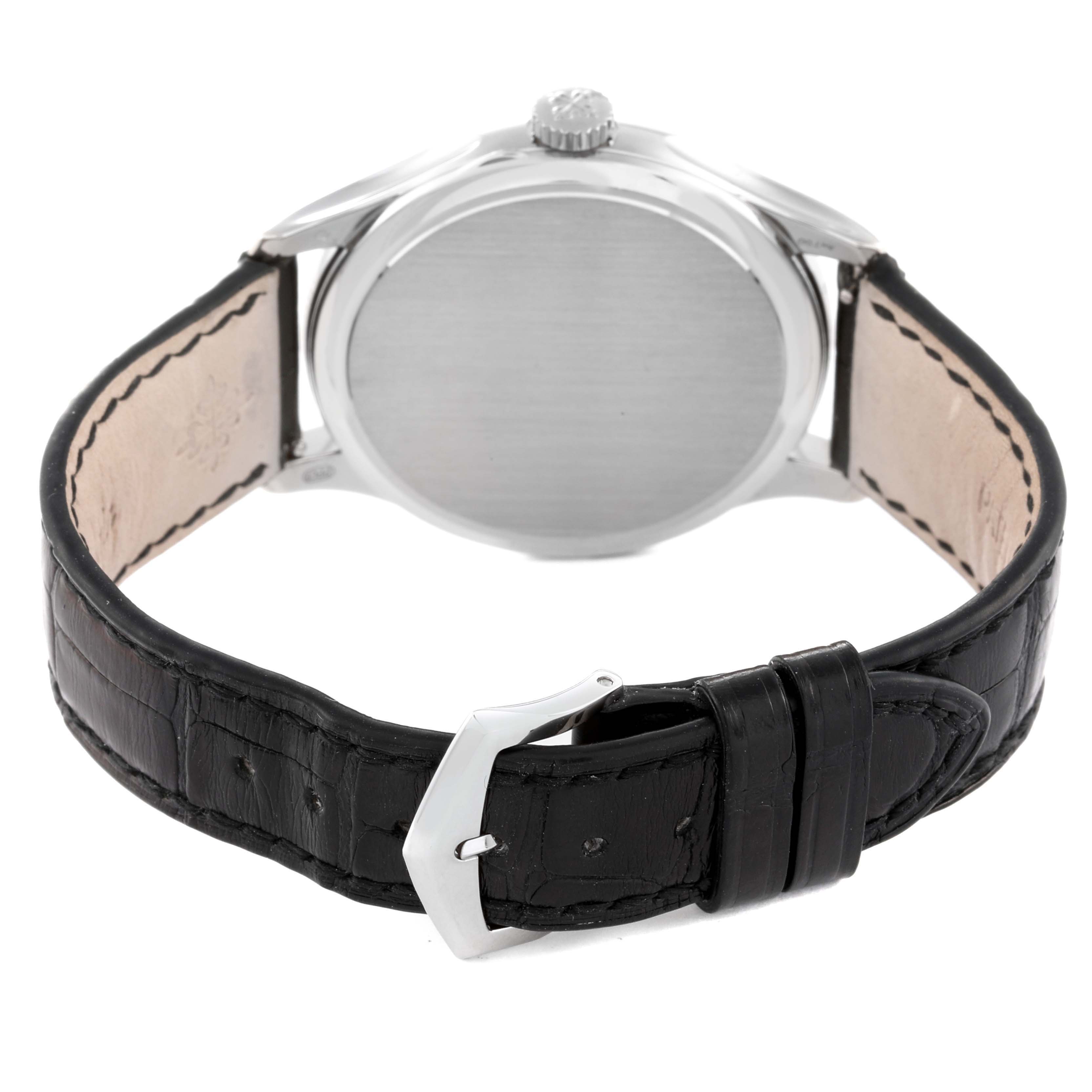 The image shows a rear view of a Patek Philippe Calatrava 5227G Men's White Gold Black Dial 5227G Men's White Gold Black Dial watch, highlighting the back case and black leather strap.
