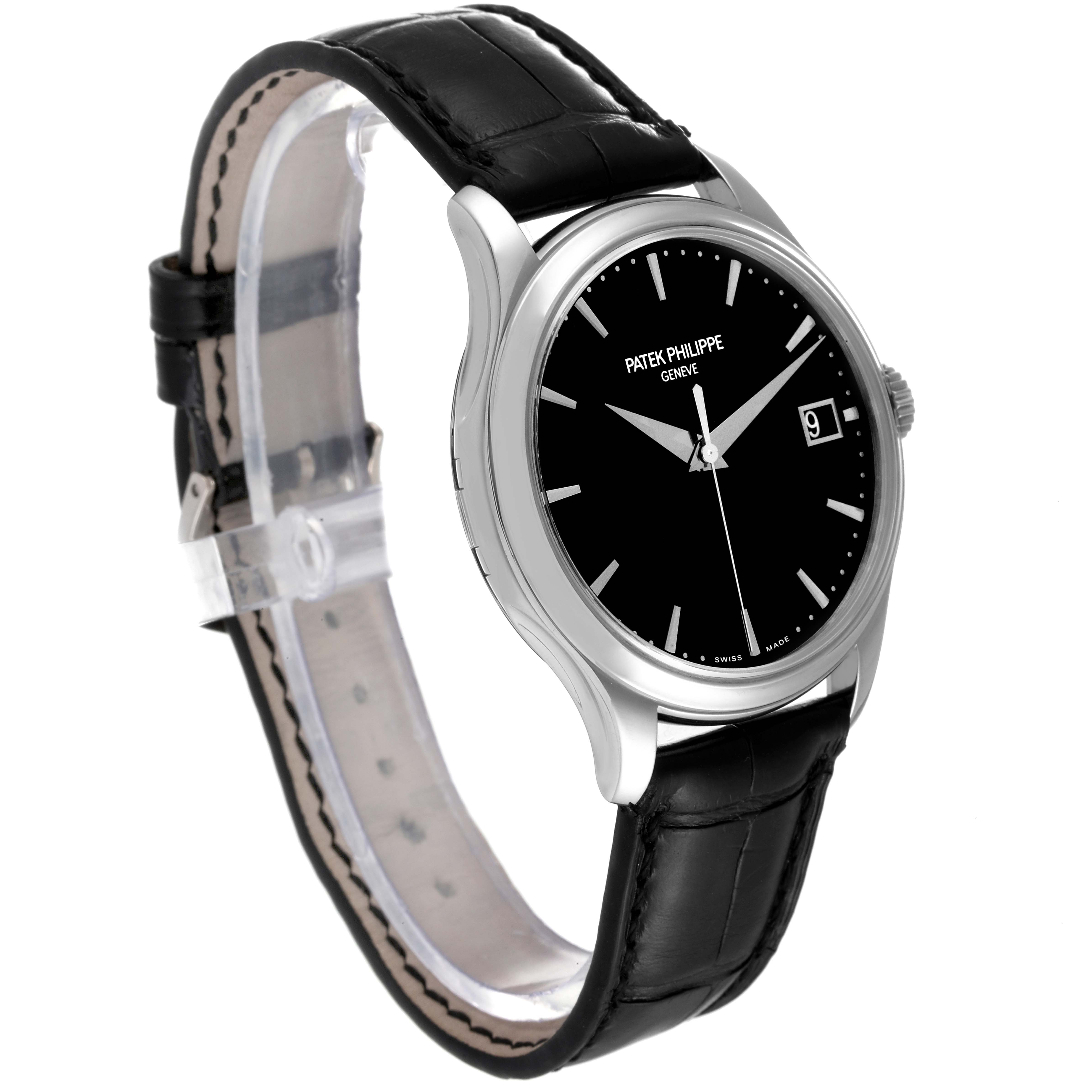The image displays a Patek Philippe Calatrava 5227G Men's White Gold Black Dial 5227G Men's White Gold Black Dial watch at an angled side view, highlighting the black dial, silver casing, and leather strap.
