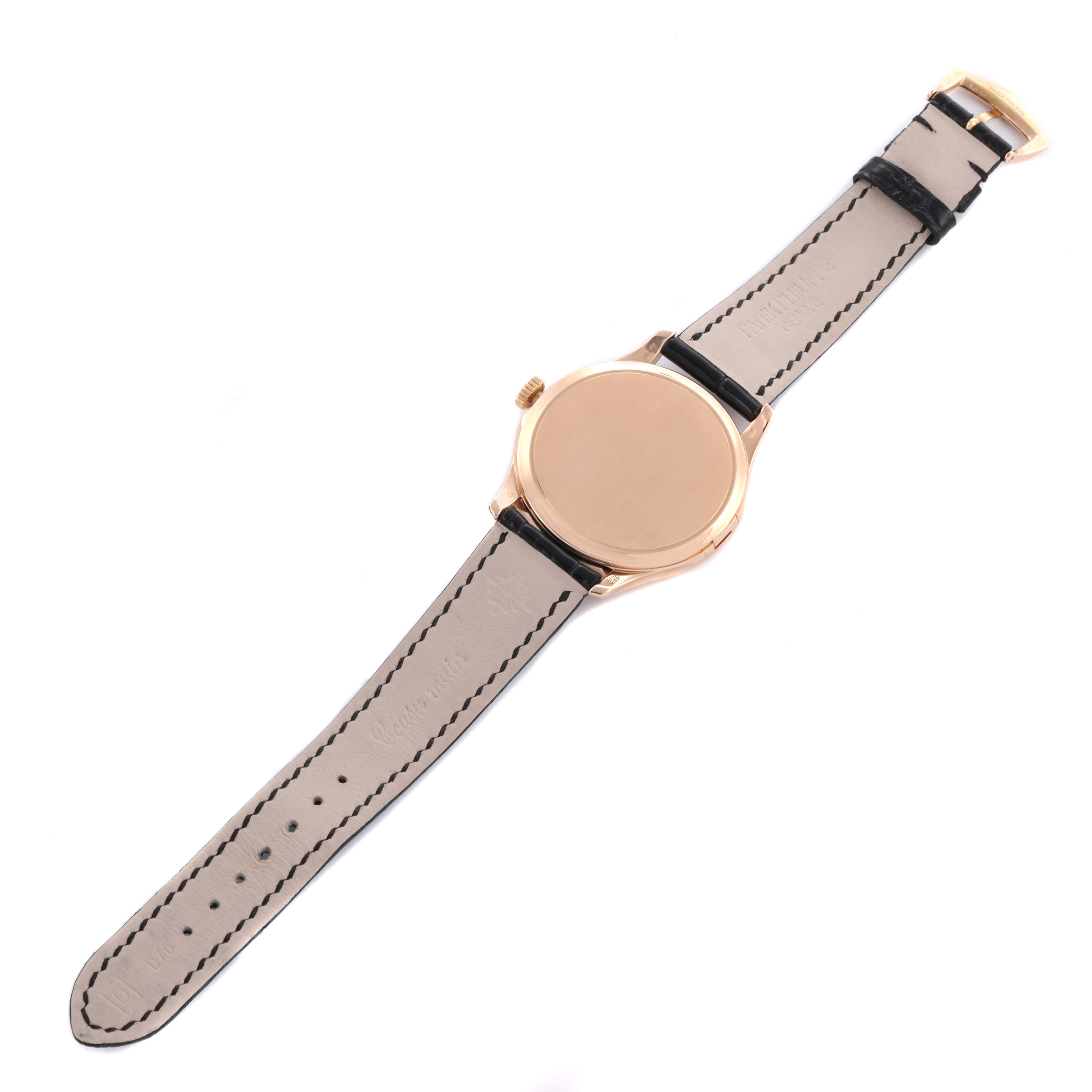 The Patek Philippe Calatrava 5227R Men's Rose Gold Beige Dial watch is shown from the back, displaying the strap and closed case back.