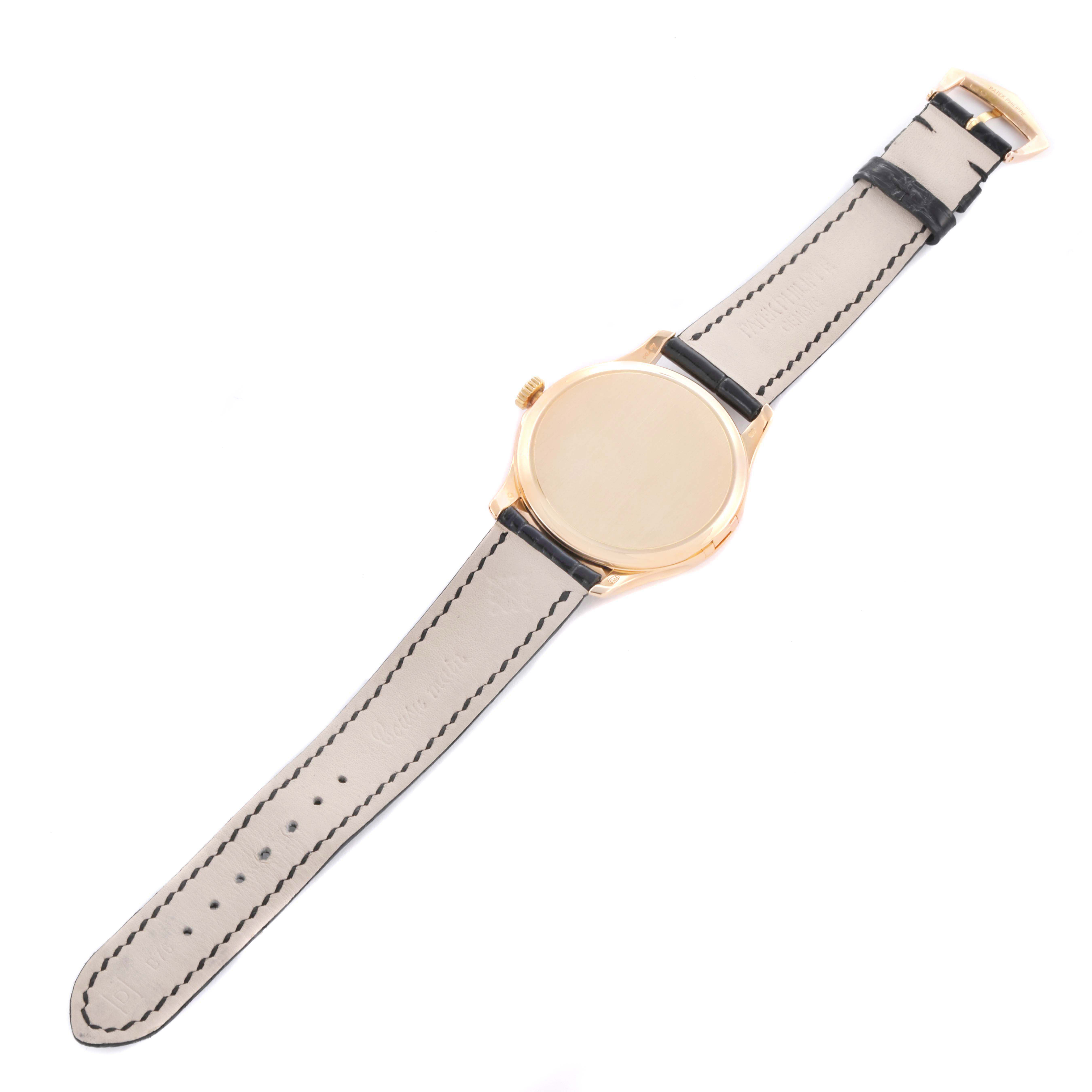 The Patek Philippe Calatrava 5227R Men's Rose Gold Beige Dial watch is shown from the top view, displaying its strap, case, and lugs.