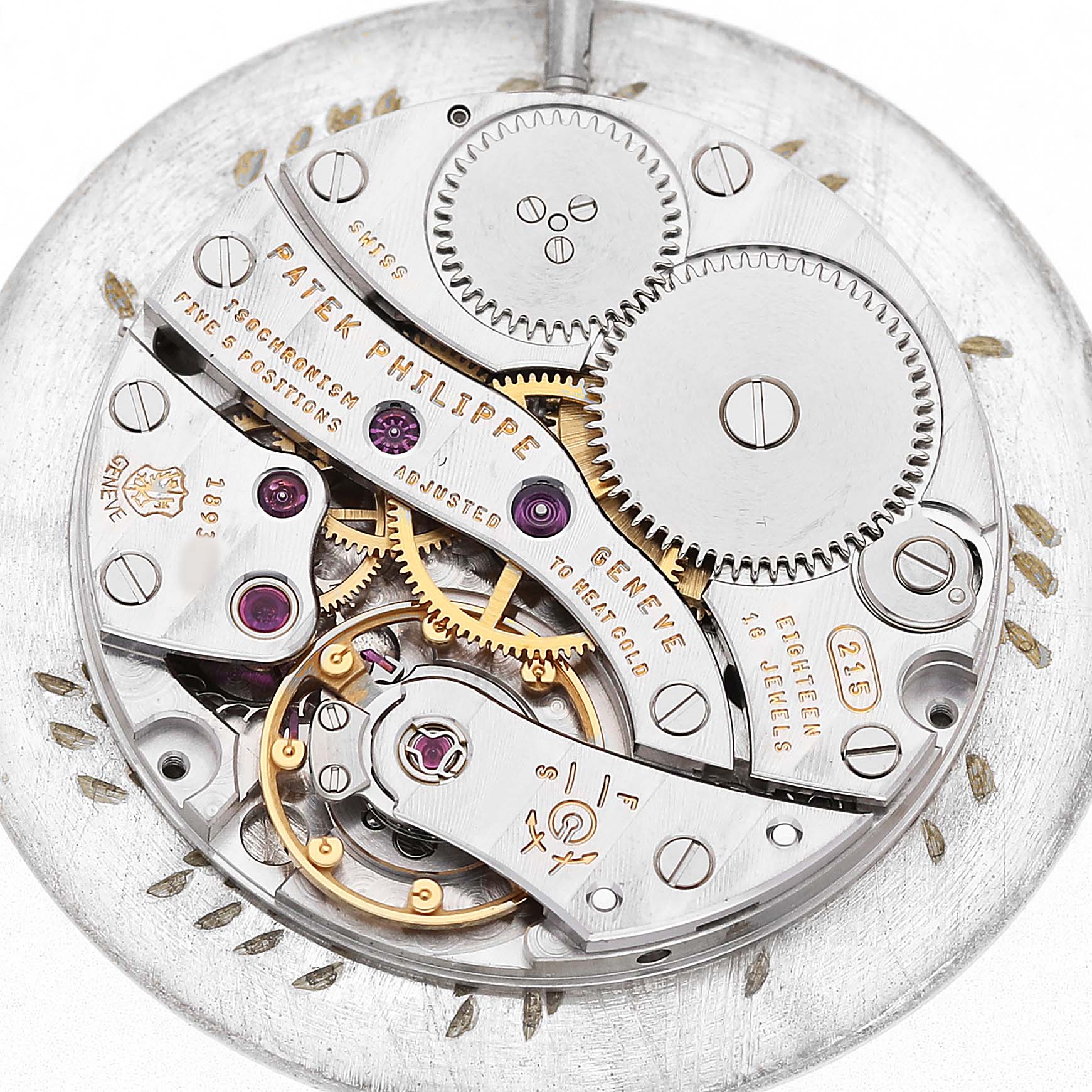 The image shows the intricate movement and inner workings of a Patek Philippe Calatrava 5022R Men's Yellow Gold White Dial watch from a top-down angle.