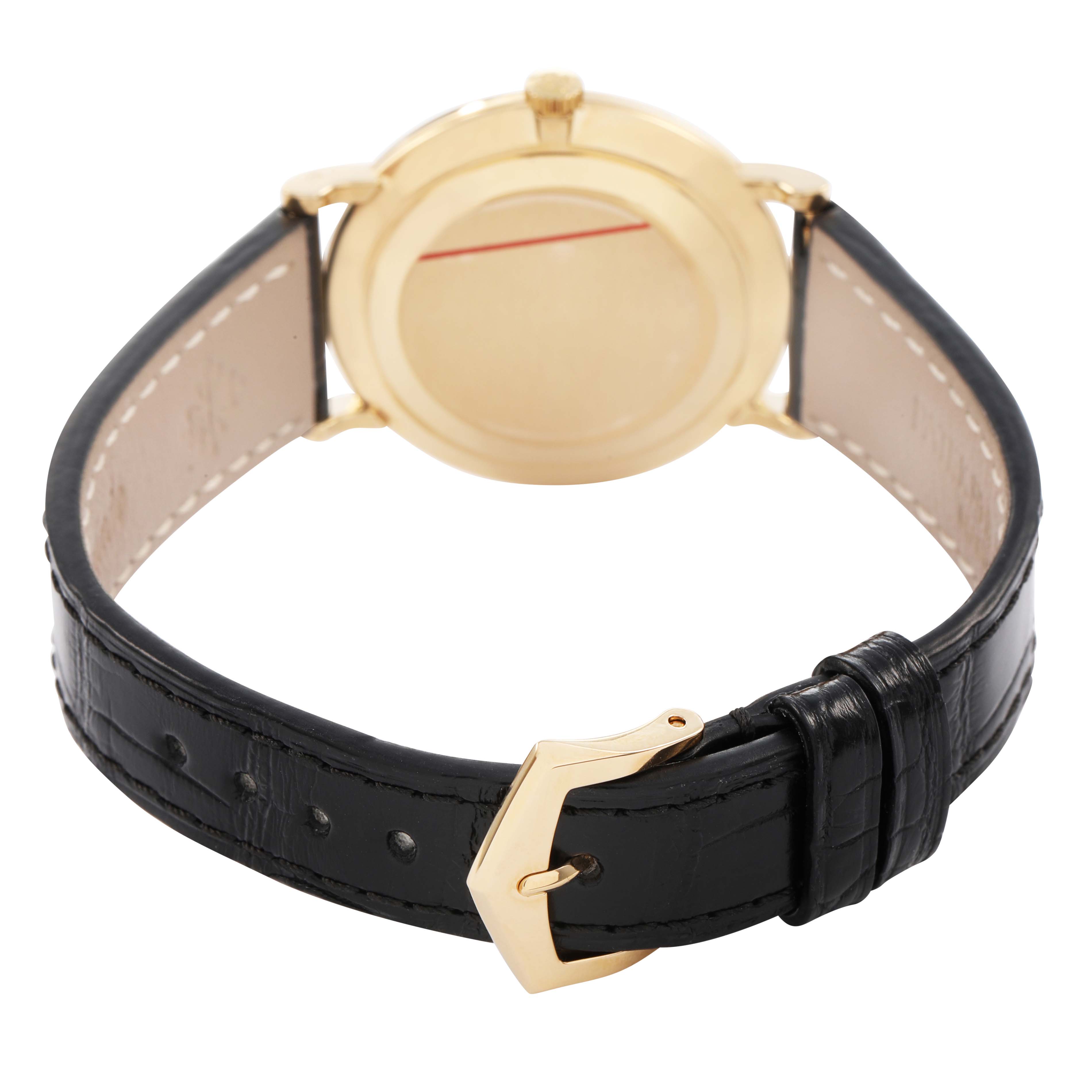 The Patek Philippe Calatrava 5022R Men's Yellow Gold White Dial watch is shown from the back, displaying the leather strap and gold buckle.