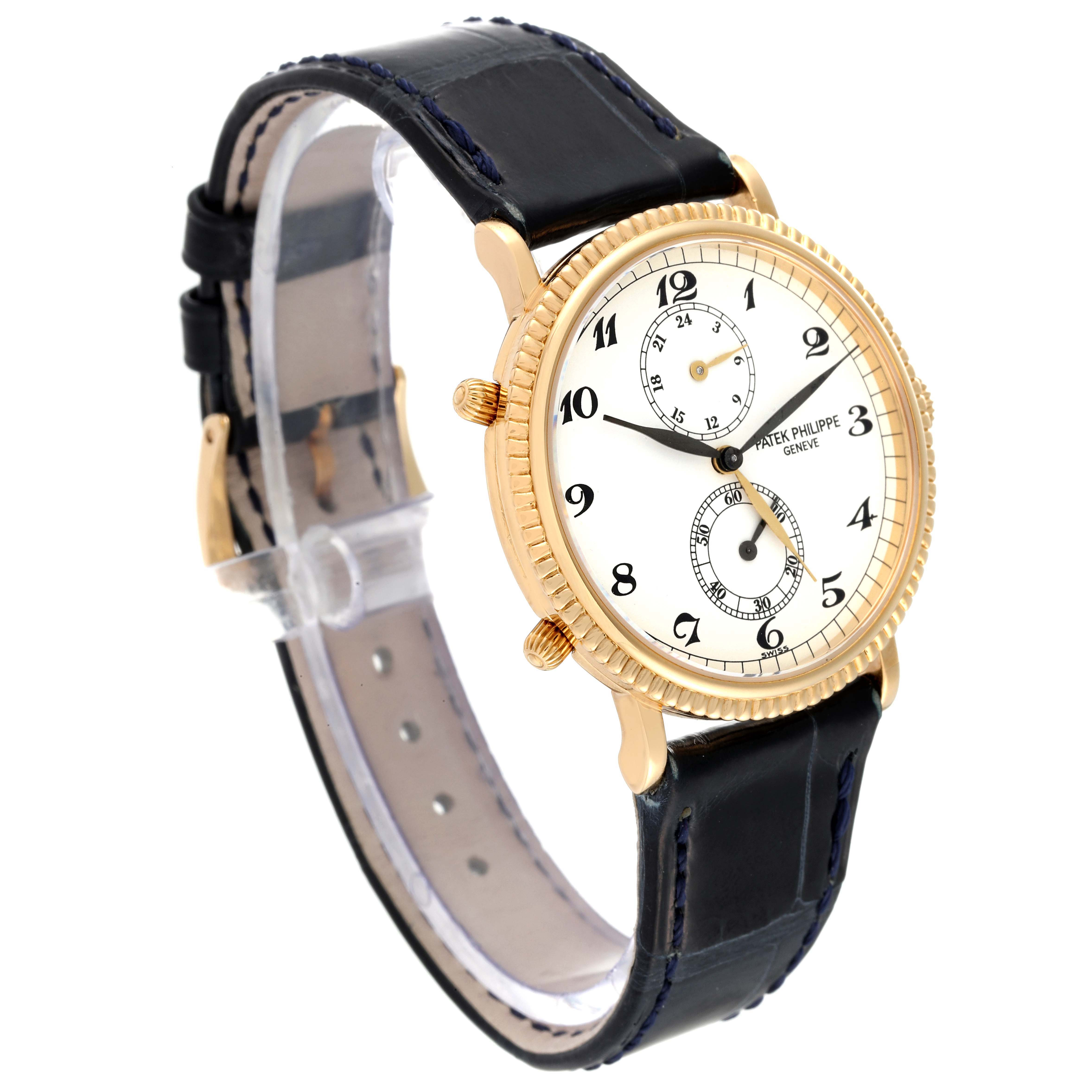 The image shows a Patek Philippe Calatrava 5034J Men's Yellow Gold White Dial 5034J Men's Yellow Gold White Dial watch at a three-quarter angle, highlighting the face, bezel, and leather strap.