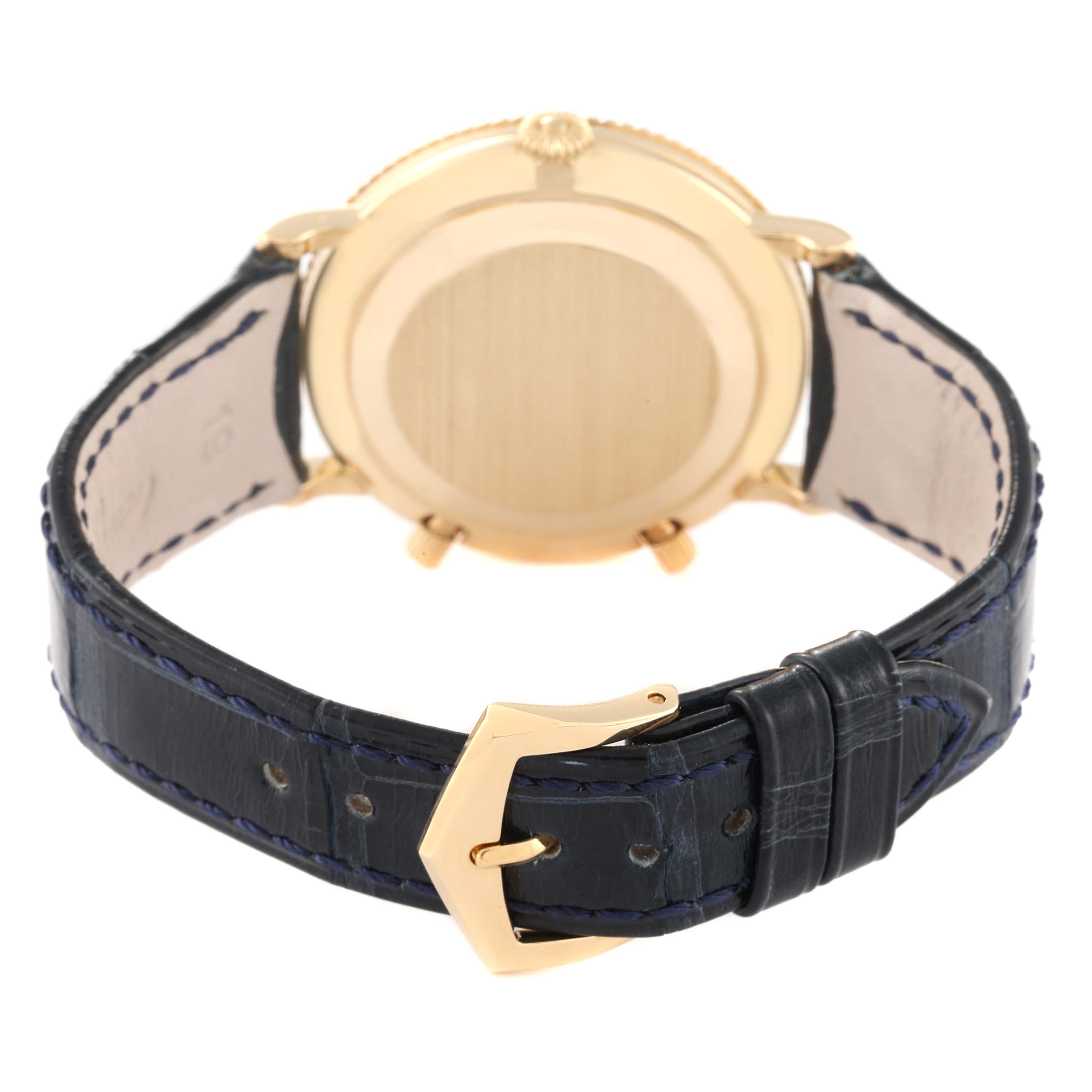 The image shows the back view of a Patek Philippe Calatrava 5034J Men's Yellow Gold White Dial 5034J Men's Yellow Gold White Dial watch, highlighting its case back and leather strap with buckle.