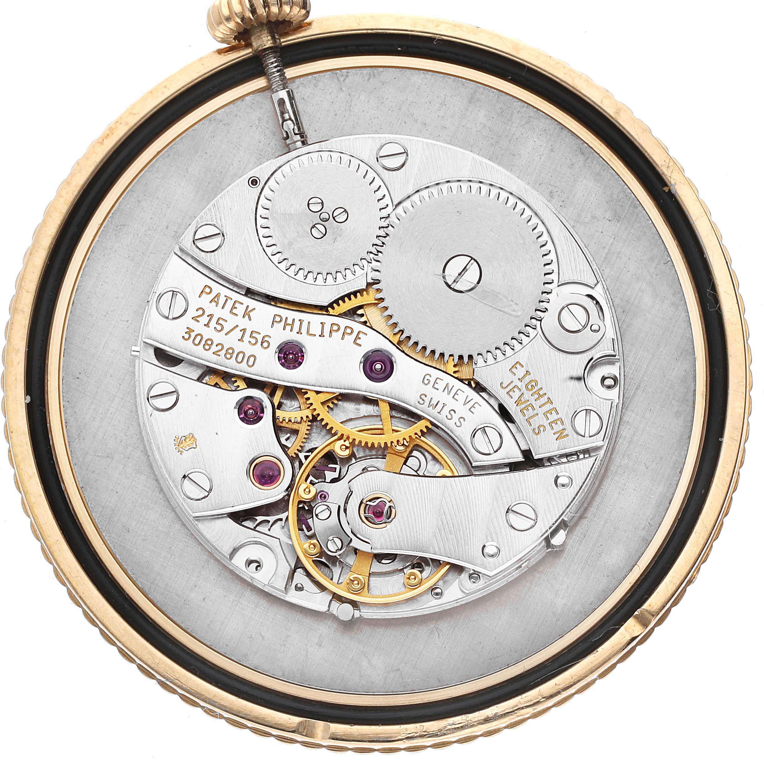The image shows a close-up of the movement and internal mechanism of a Patek Philippe Calatrava 5034J Men's Yellow Gold White Dial 5034J Men's Yellow Gold White Dial watch.