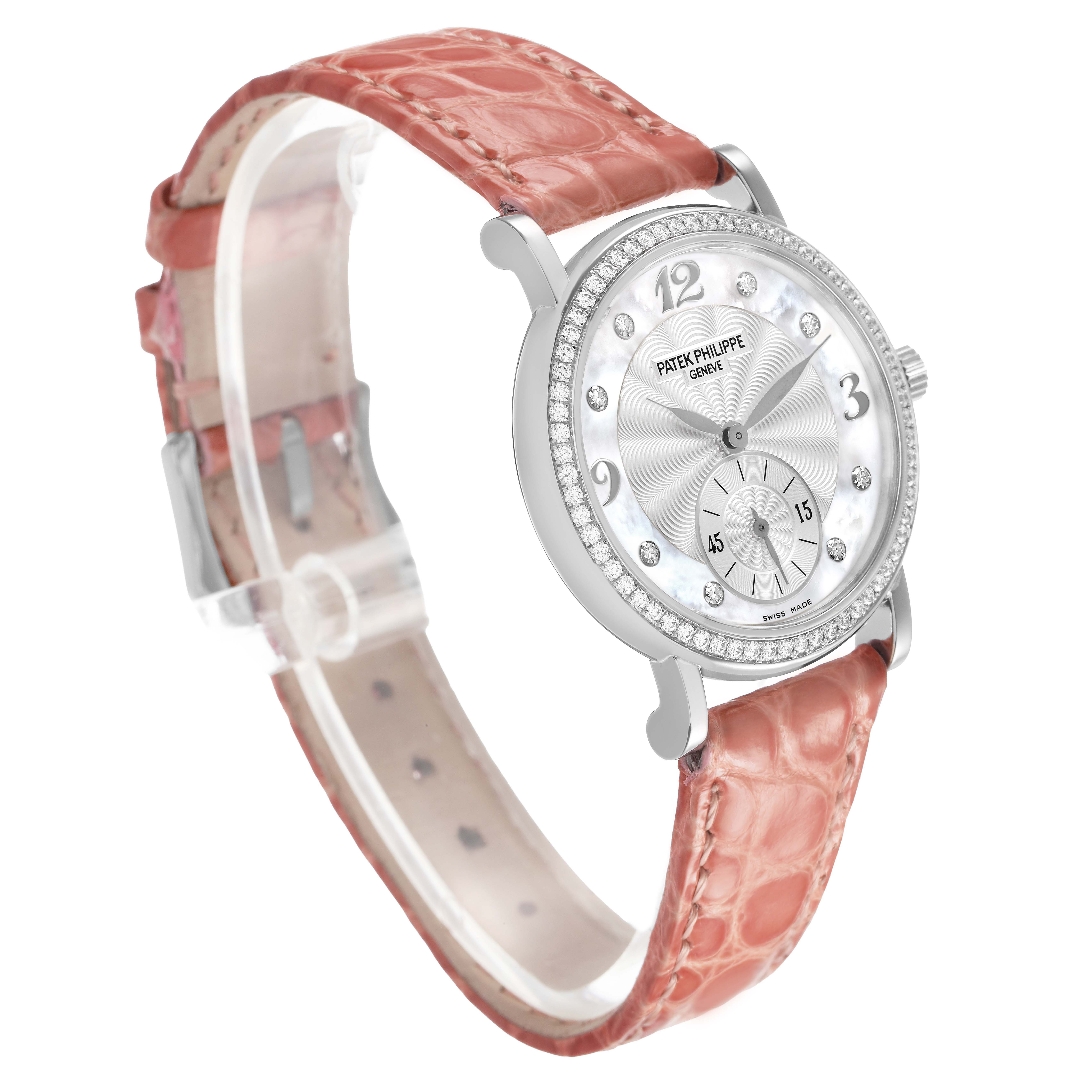 The Patek Philippe Calatrava 4959G Women's White Gold Silver Dial watch is shown from a three-quarter angle, highlighting the dial, bezel, and pink strap.