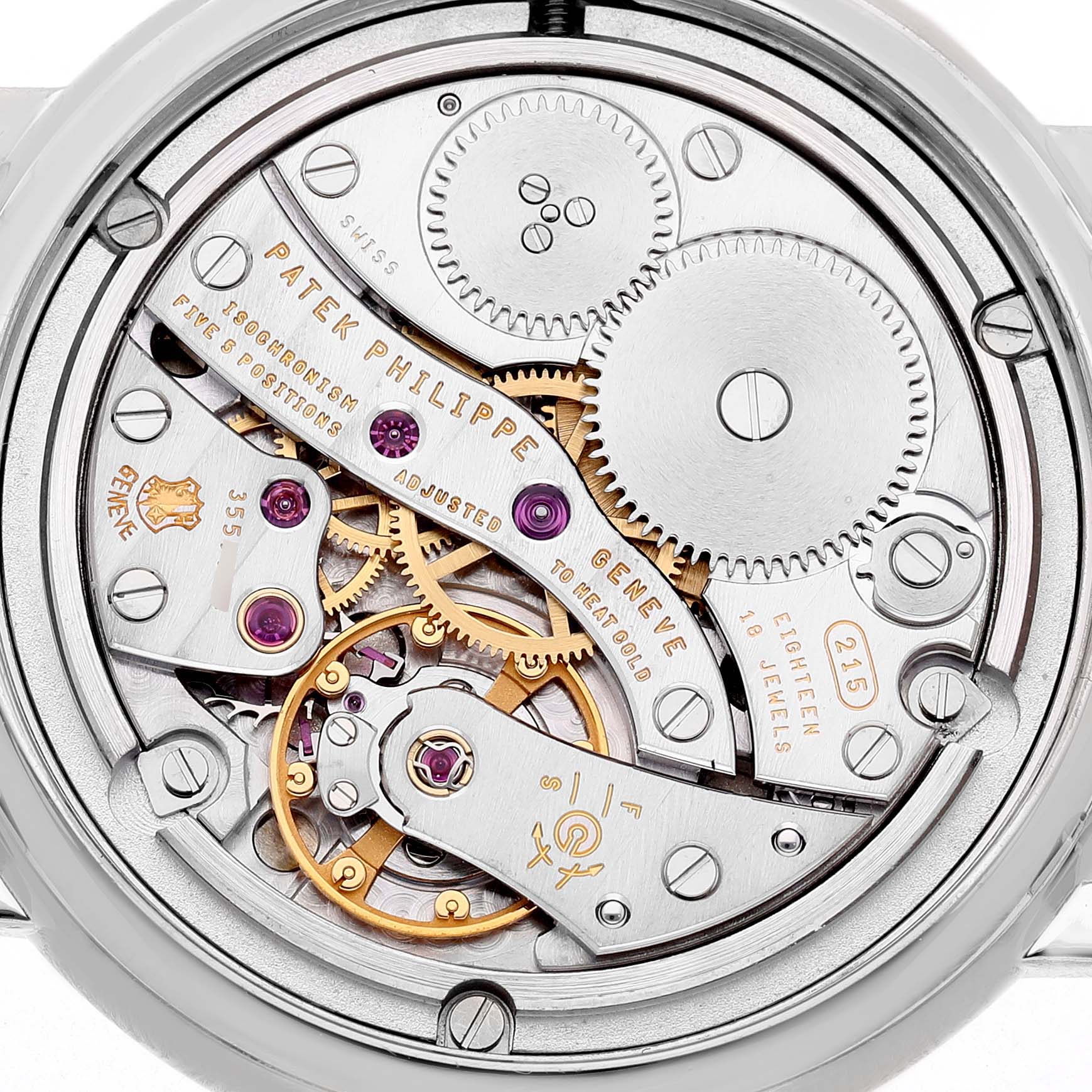 The image shows the intricate mechanical movement of the Patek Philippe Calatrava 4959G Women's White Gold Silver Dial from the back.