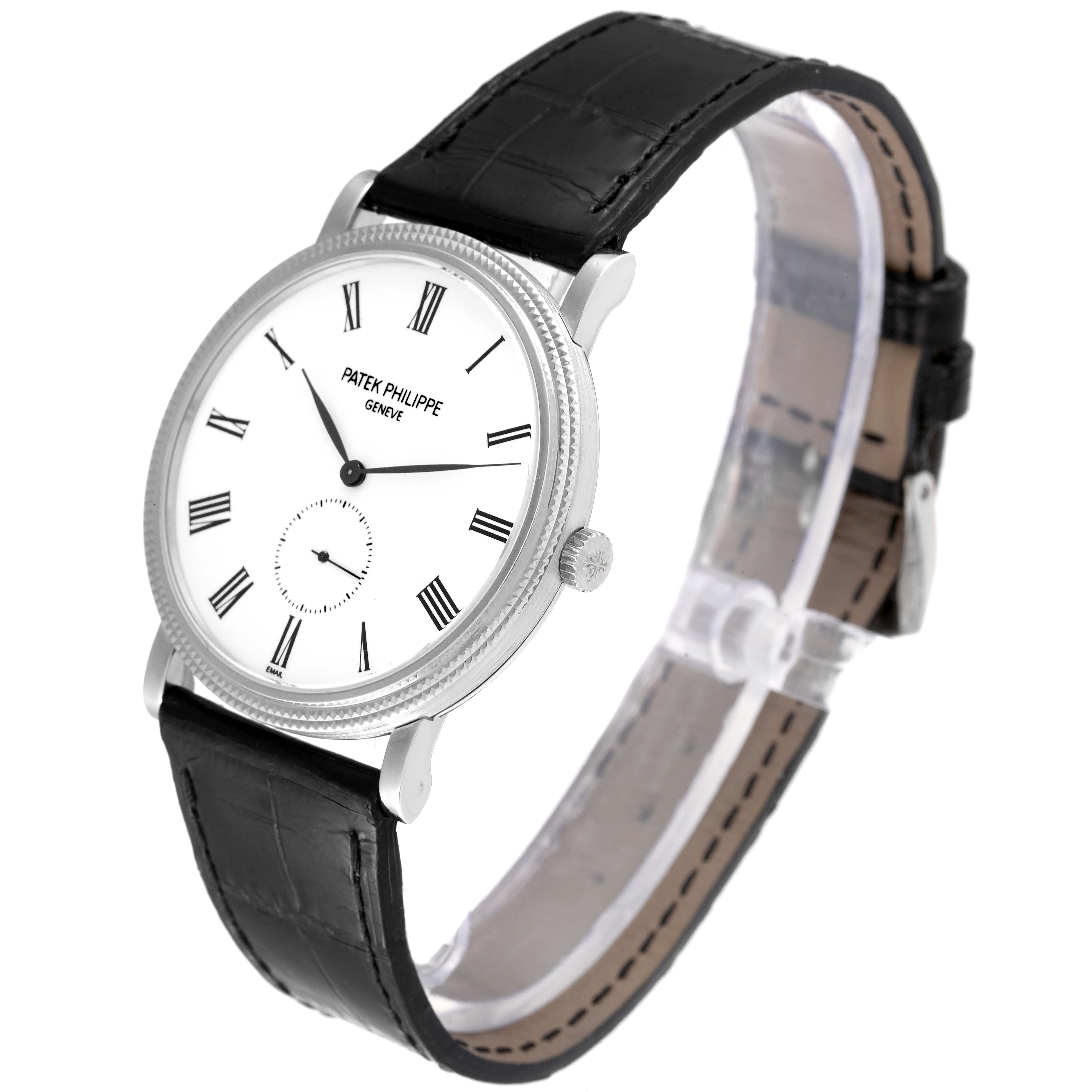 The image shows a Patek Philippe Calatrava 5116G Men
s White Gold White Dial 5116G Men
s White Gold White Dial watch at a three-quarter angle, displaying the face, crown, and black leather strap.