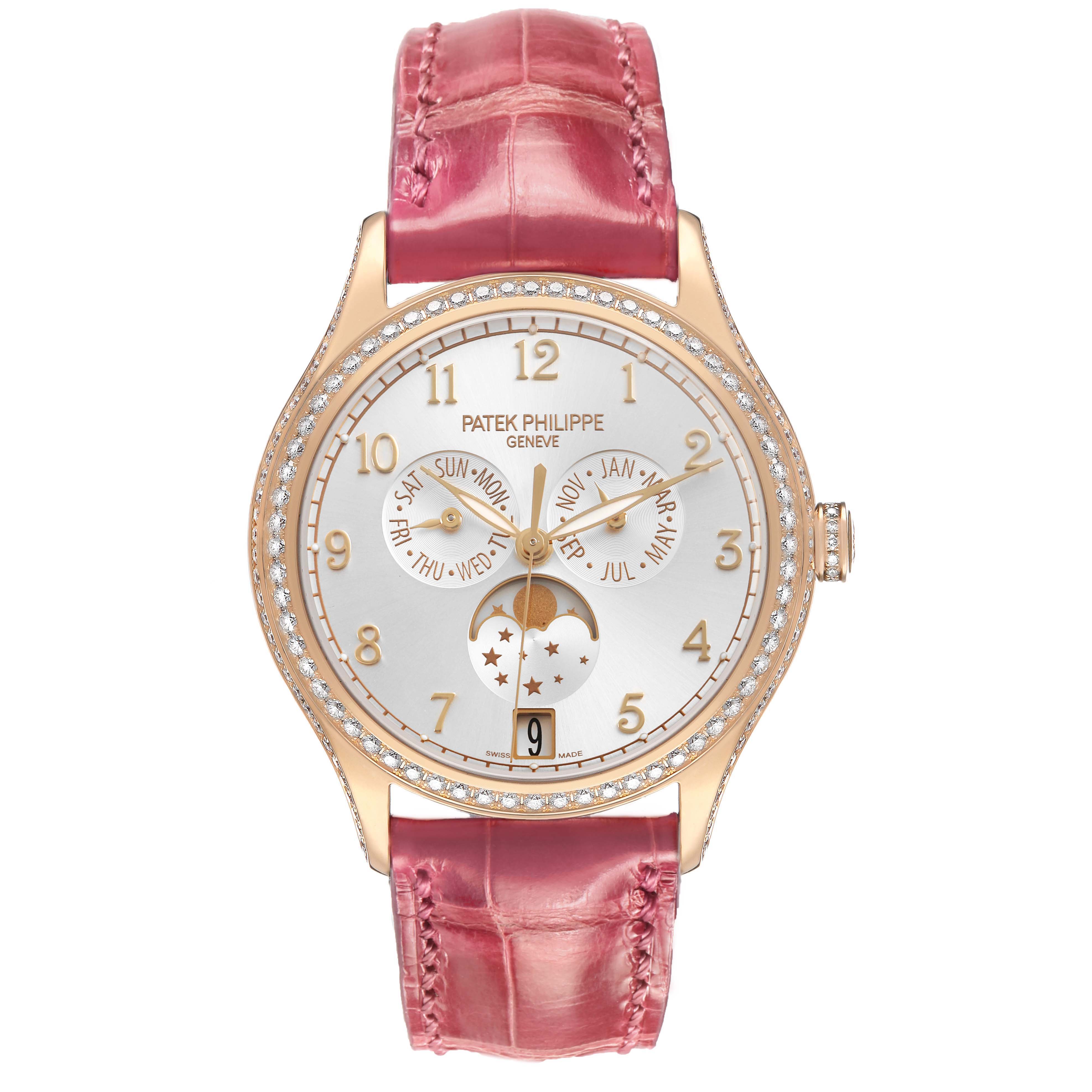 The Patek Philippe Complications 4947R-001 Men's Rose Gold Silver Dial watch is shown from the front, featuring its dial, bezel, and pink strap.