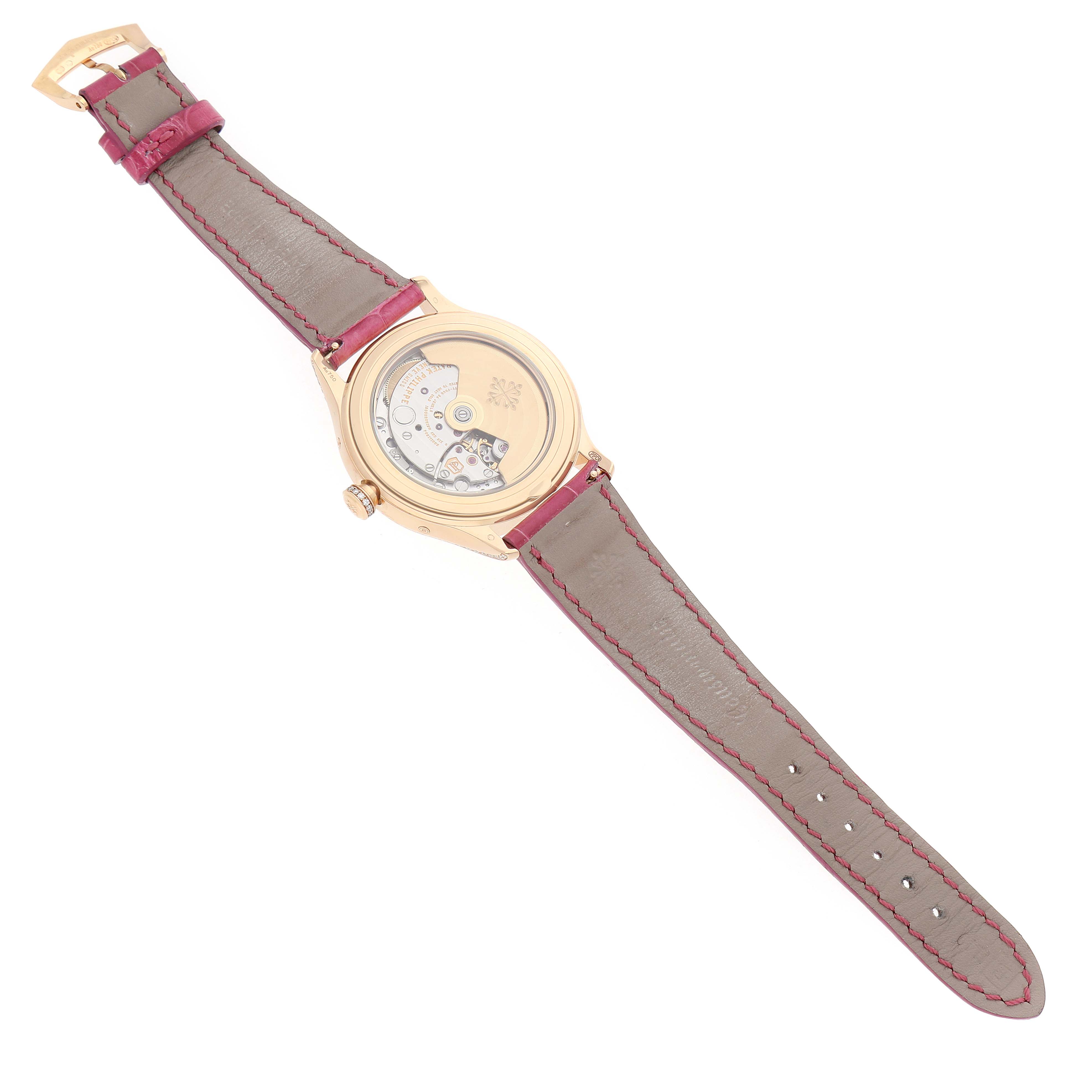 The image shows a Patek Philippe Complications 4947R-001 Men's Rose Gold Silver Dial model from the back, highlighting its movement and transparent caseback.