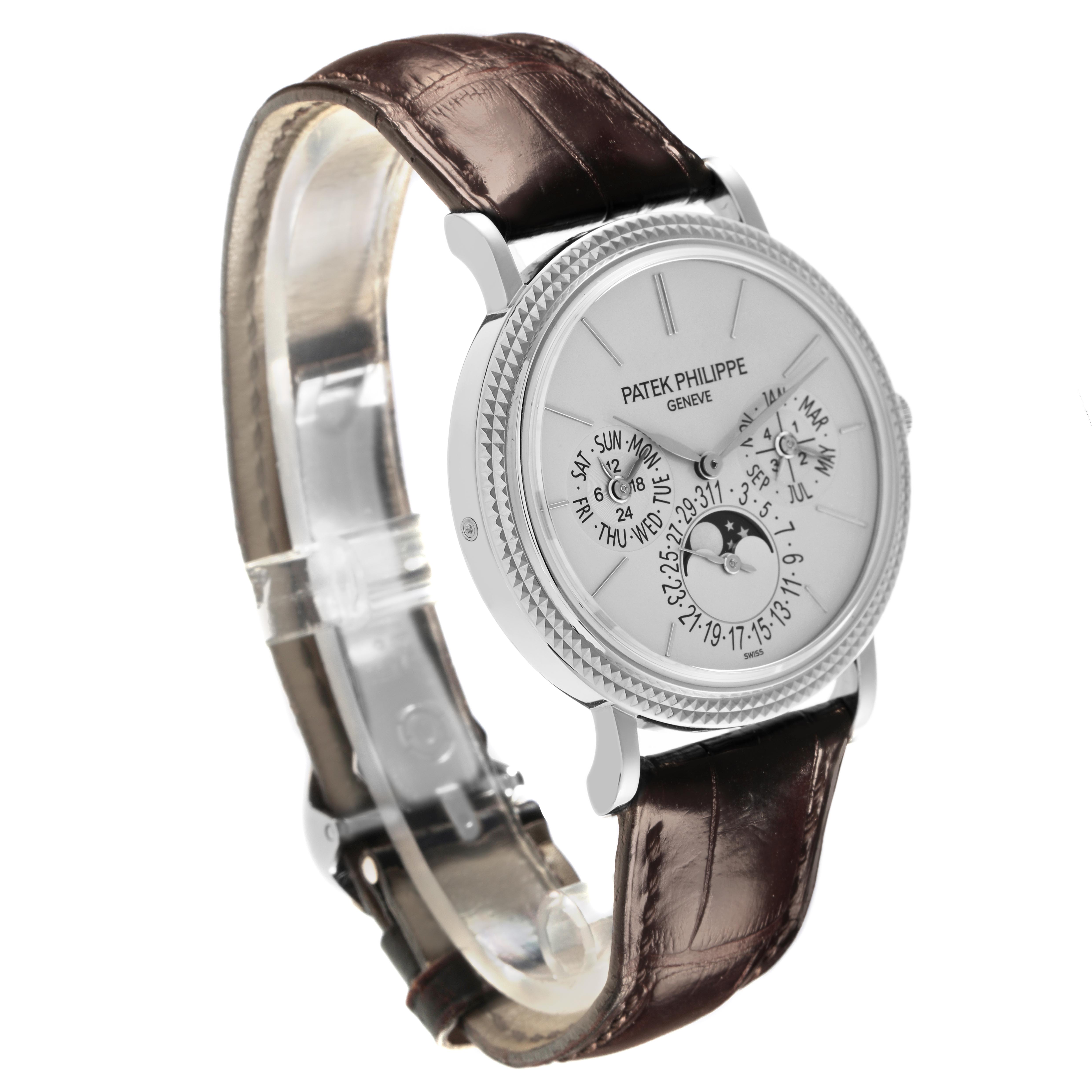 The Patek Philippe Complications 5139G-001 Men's White Gold Silver Dial 5139G-001 Men's White Gold Silver Dial watch is shown at a three-quarter angle, displaying the face, bezel, crown, and leather strap.