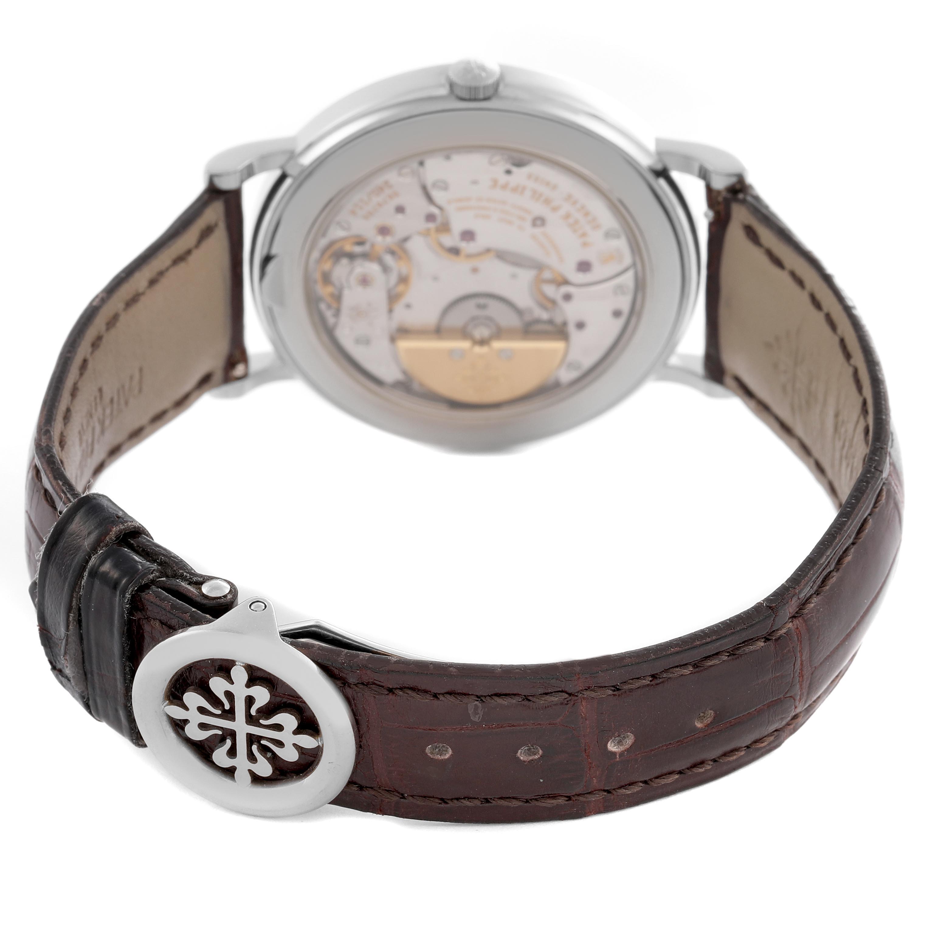 The image shows the back view of the Patek Philippe Complications 5139G-001 Men's White Gold Silver Dial 5139G-001 Men's White Gold Silver Dial watch, highlighting its movement and leather strap.