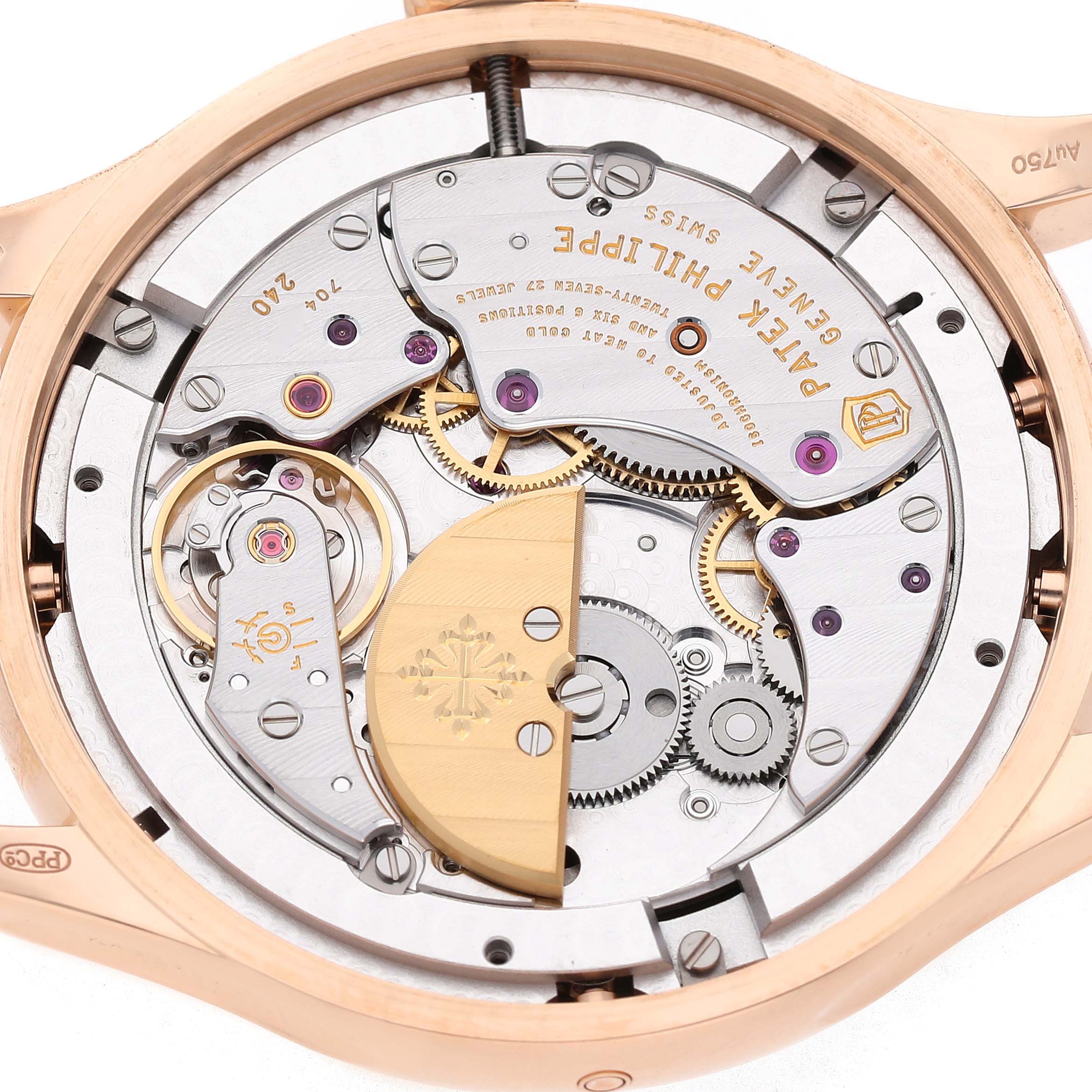 The image shows the movement and mechanism of the Patek Philippe Complications 5327R Men's Rose Gold Beige Dial watch from the back, highlighting its intricate details.