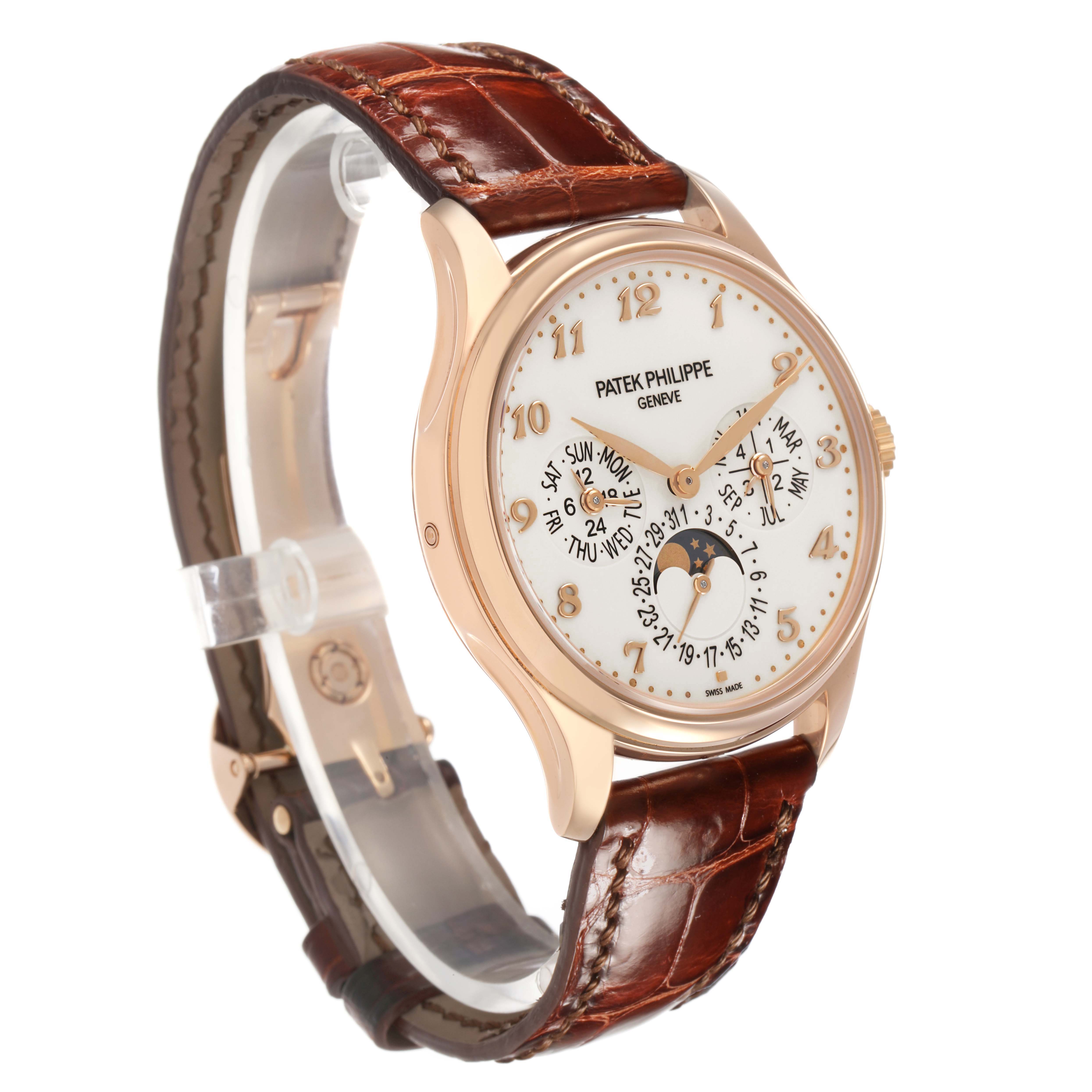 The Patek Philippe Complications 5327R Men's Rose Gold Beige Dial watch is shown at a left-side angle, highlighting its dial, leather strap, and crown.