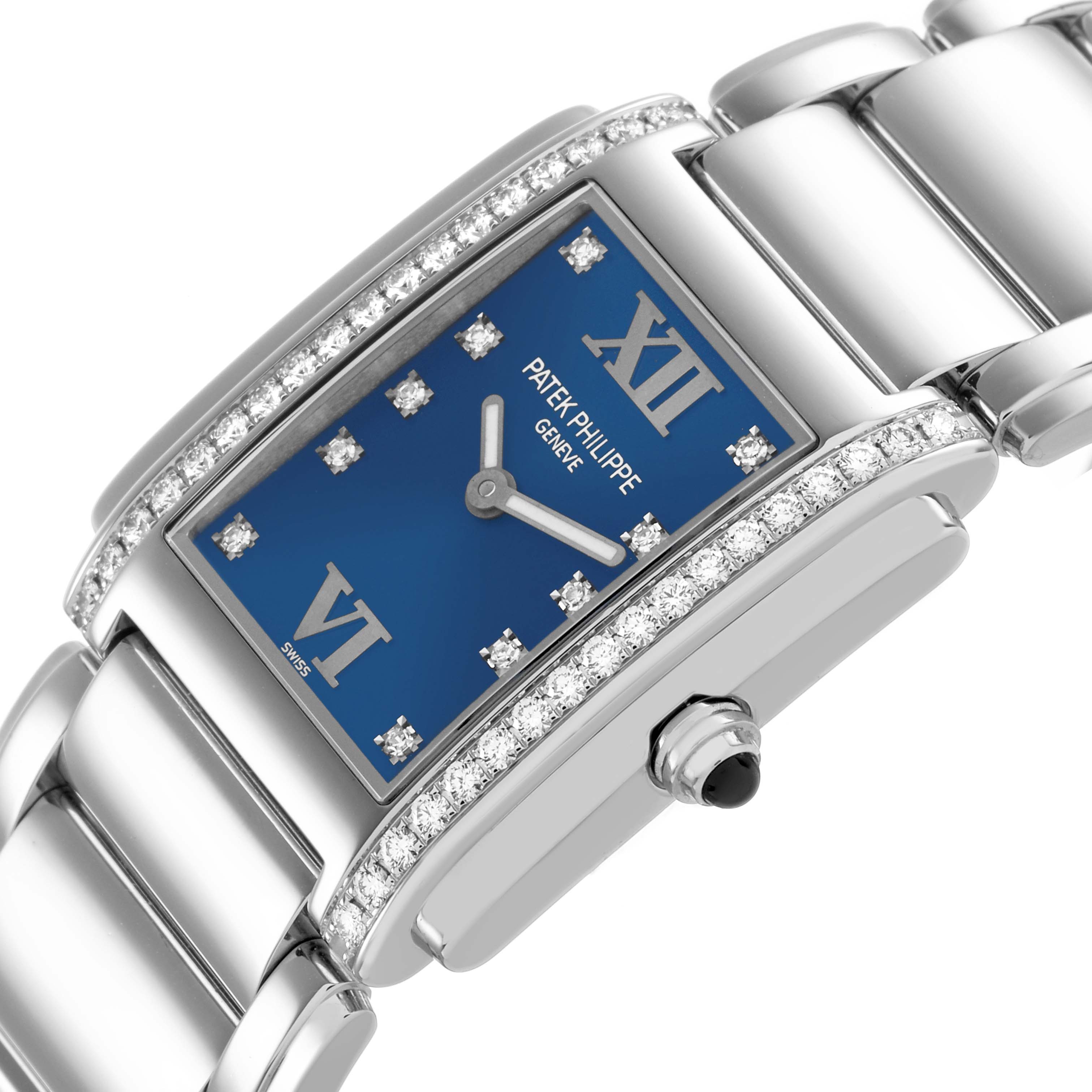 The Patek Philippe Twenty-4 4910A Women's Stainless Steel Blue Dial watch is shown at an angled view highlighting the blue dial, diamond bezel, and stainless steel bracelet.