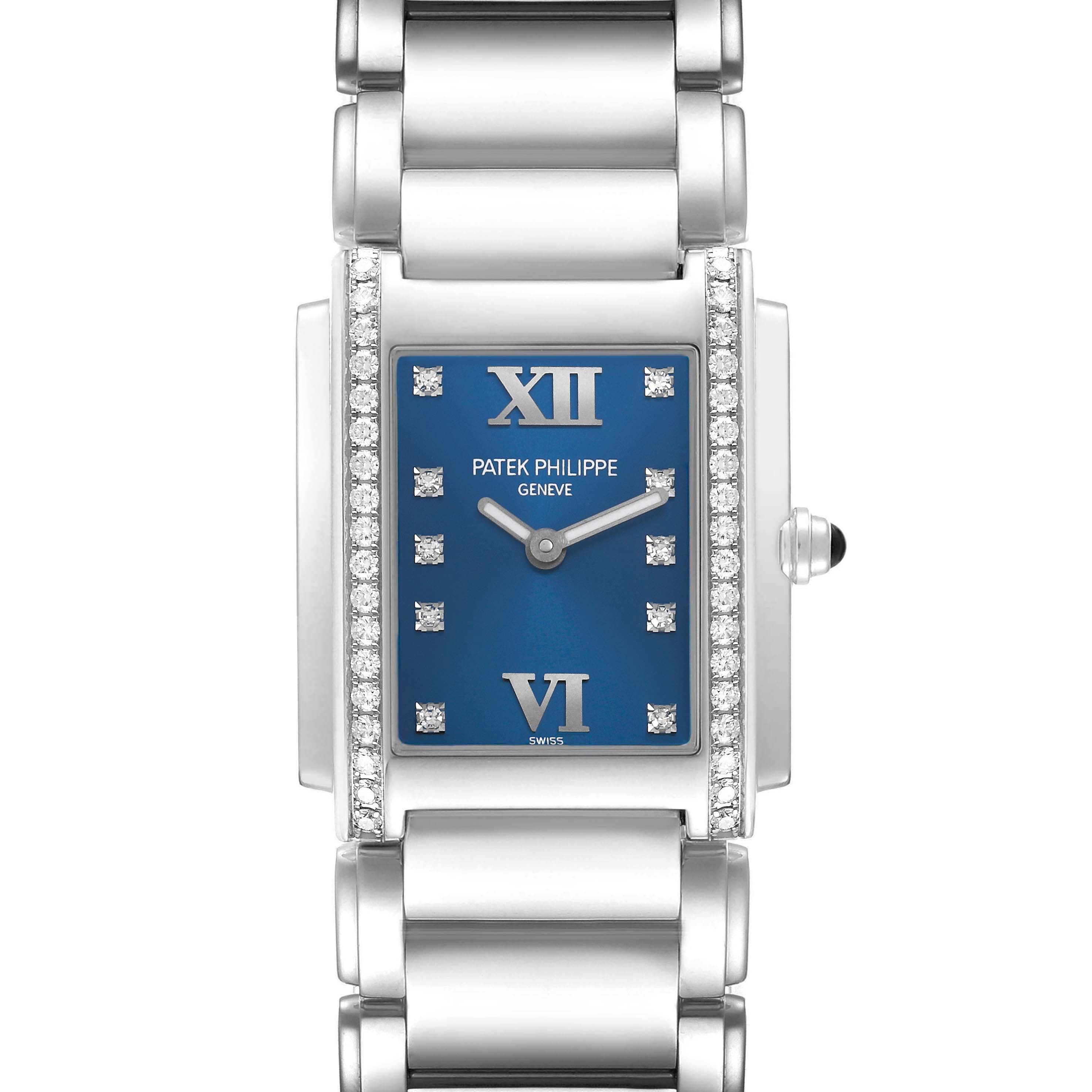The Patek Philippe Twenty-4 4910A Women's Stainless Steel Blue Dial watch is shown from a top-down angle, highlighting its blue dial, diamond-set bezel, and metal bracelet.