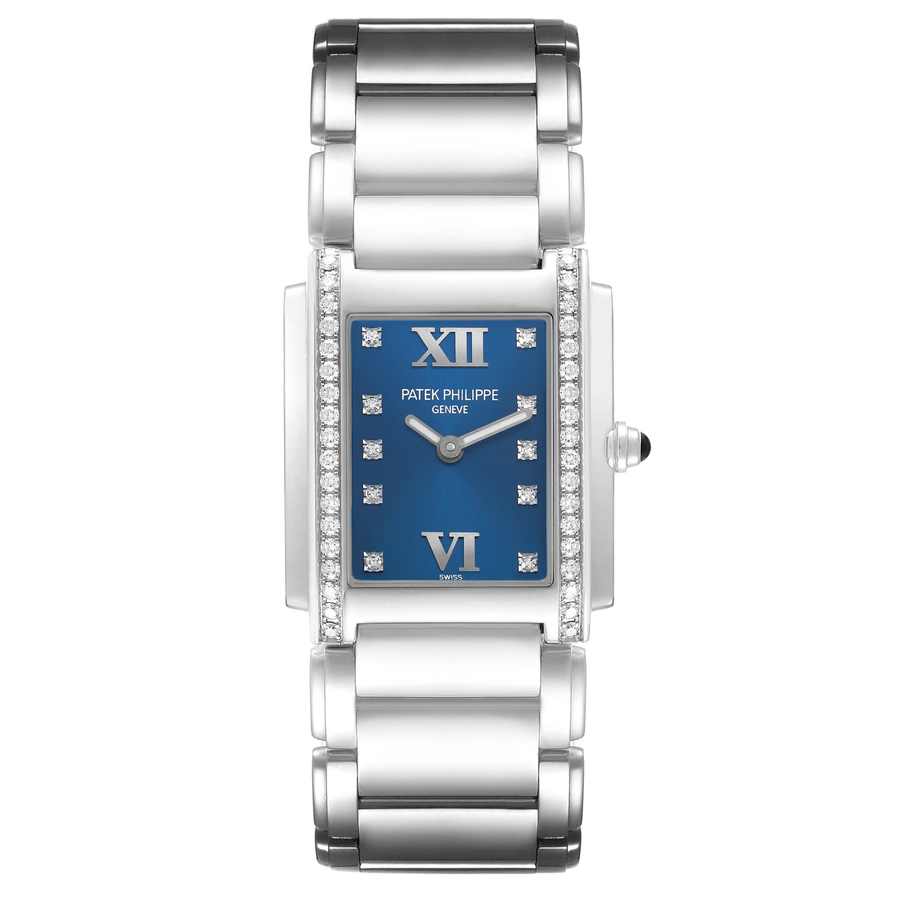 The Patek Philippe Twenty-4 4910A Women's Stainless Steel Blue Dial watch is shown from a top view, highlighting its blue dial, diamond-set bezel, and metallic bracelet.