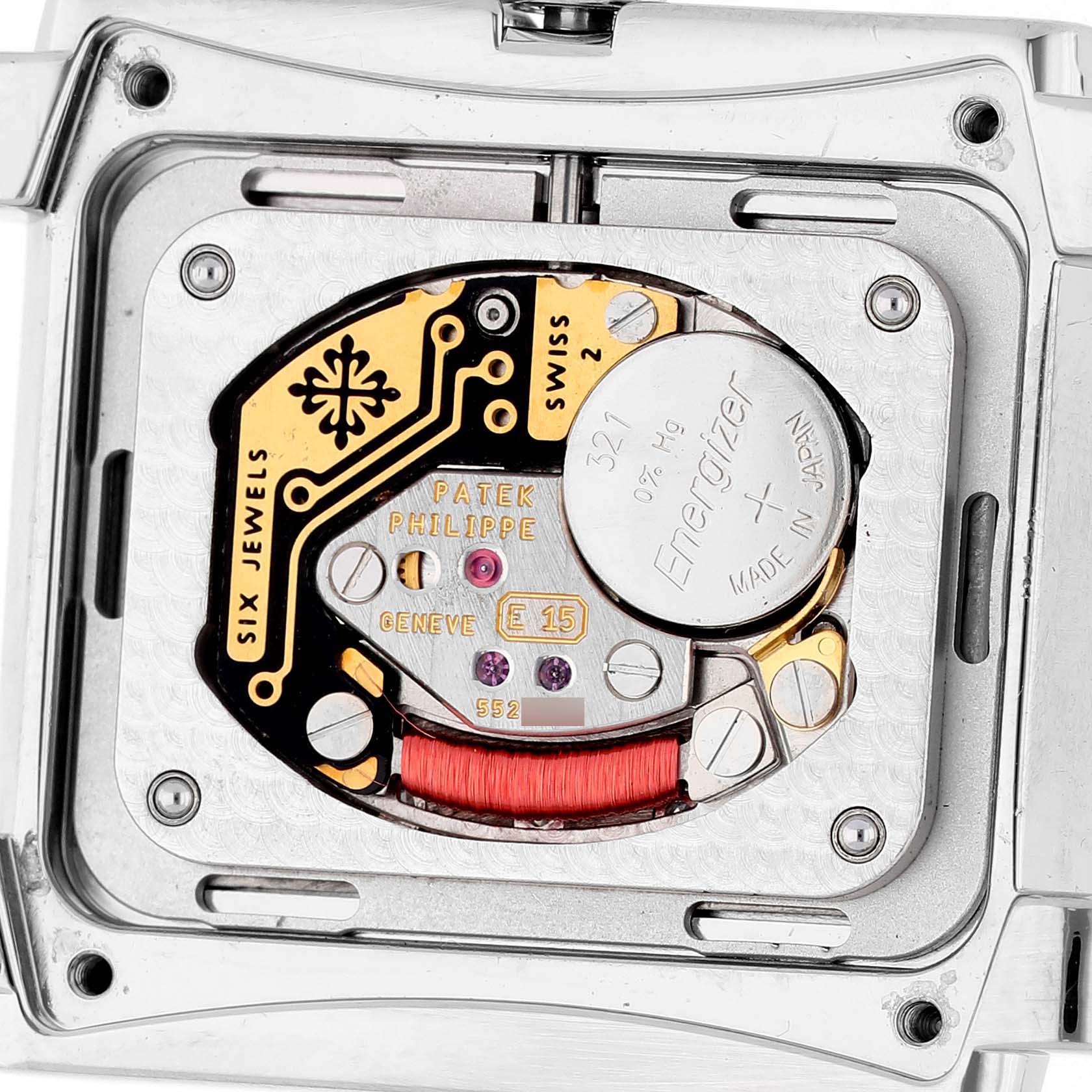 The image shows the back view of the Patek Philippe Twenty-4 4910A Women's Stainless Steel Blue Dial watch, highlighting its movement and battery compartment.