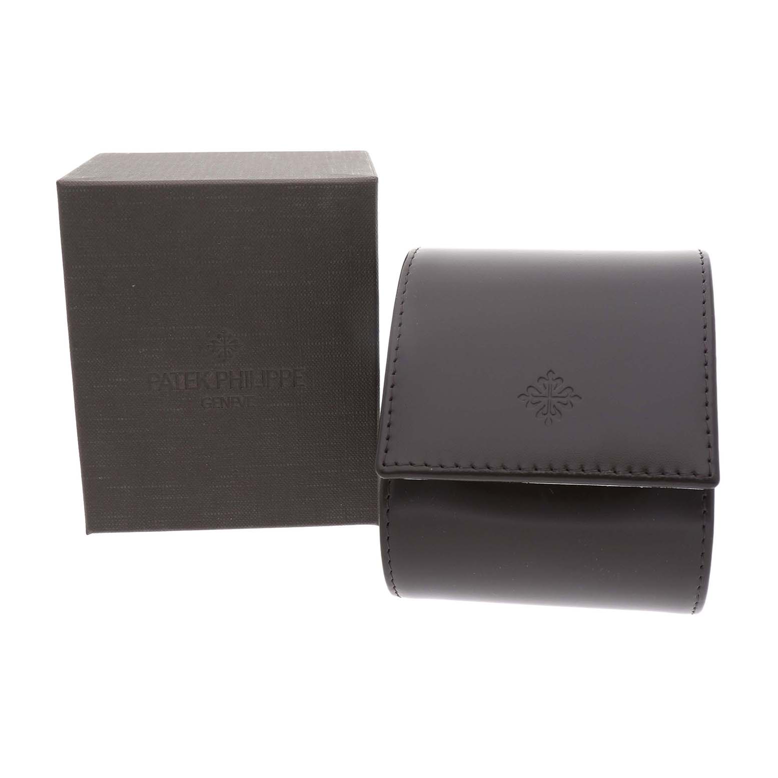 The image shows a Patek Philippe Twenty-4 4910A Women's Stainless Steel Blue Dial watch box and a leather case from a front angle.