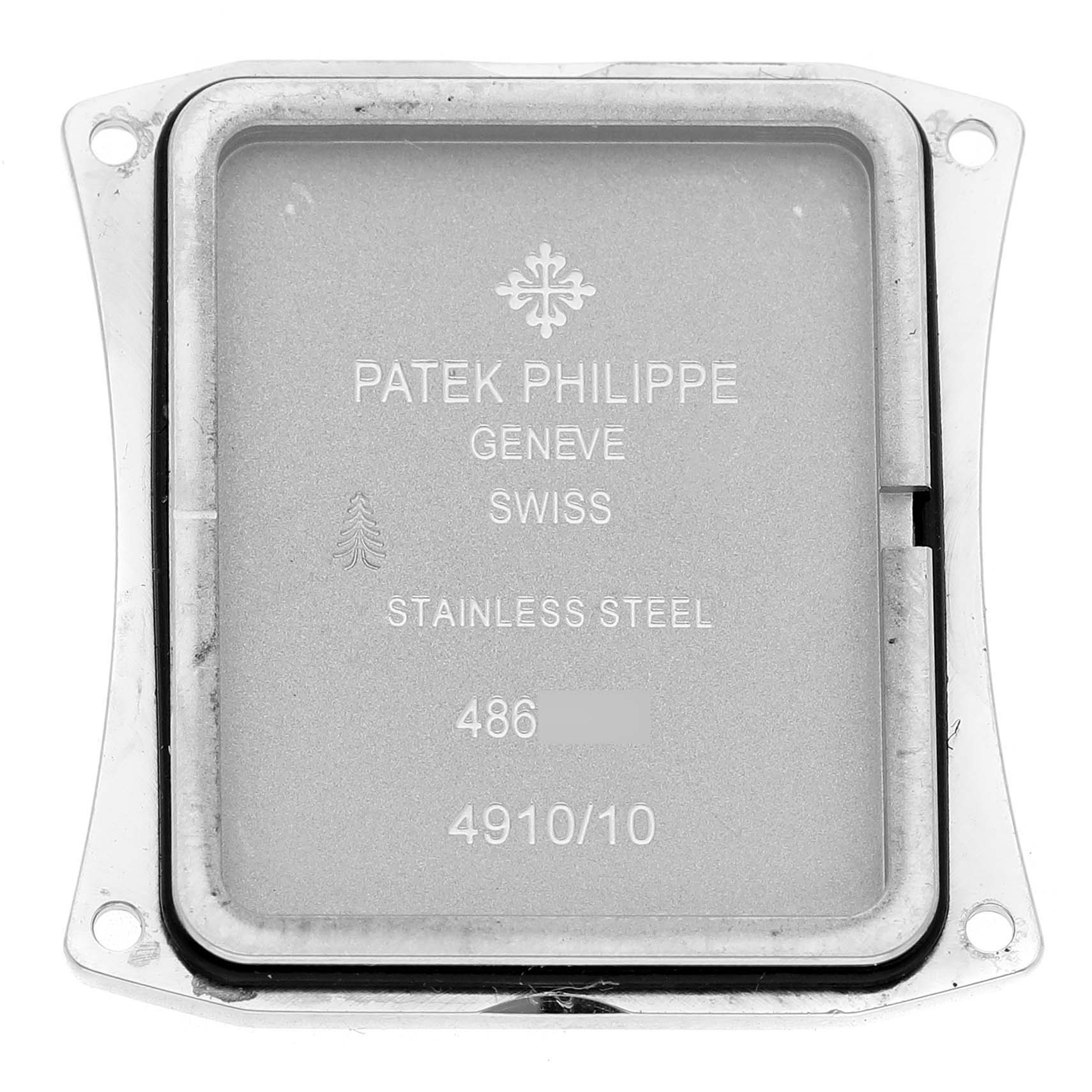 The image shows the back cover of a Patek Philippe Twenty-4 4910A Women's Stainless Steel Blue Dial, displaying engravings and a metal surface.