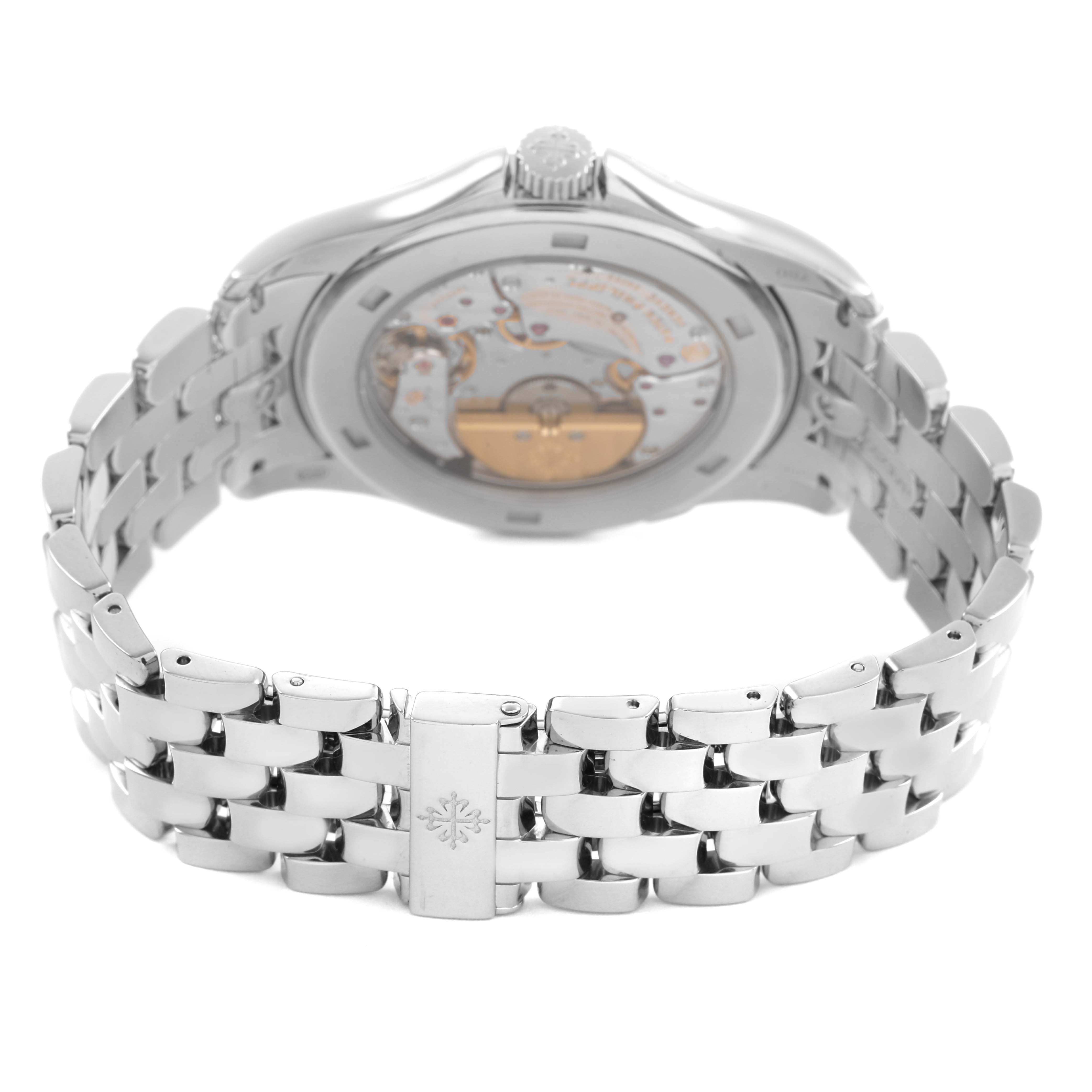 The Patek Philippe Complications 5130G Men's White Gold Silver Dial watch is shown from the back, highlighting its detailed case back and metal bracelet.