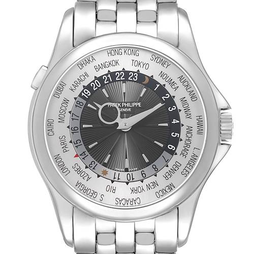 The image shows a front view of the Patek Philippe Complications 5130G Men's White Gold Silver Dial watch, highlighting the world time display and silver bracelet.