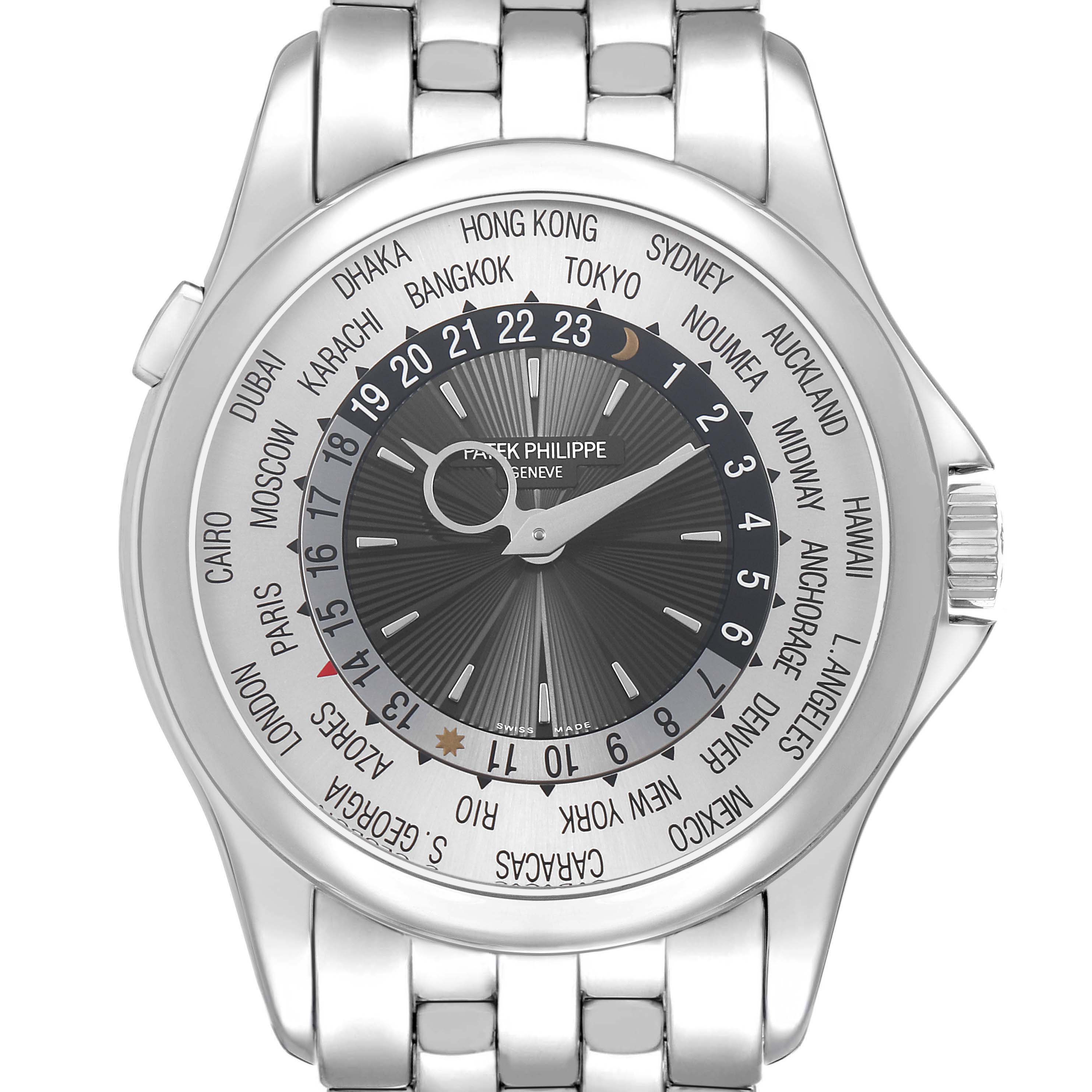 The Patek Philippe Complications 5130G Men's White Gold Silver Dial watch is shown from a top view, highlighting its face, city ring, and metal bracelet.
