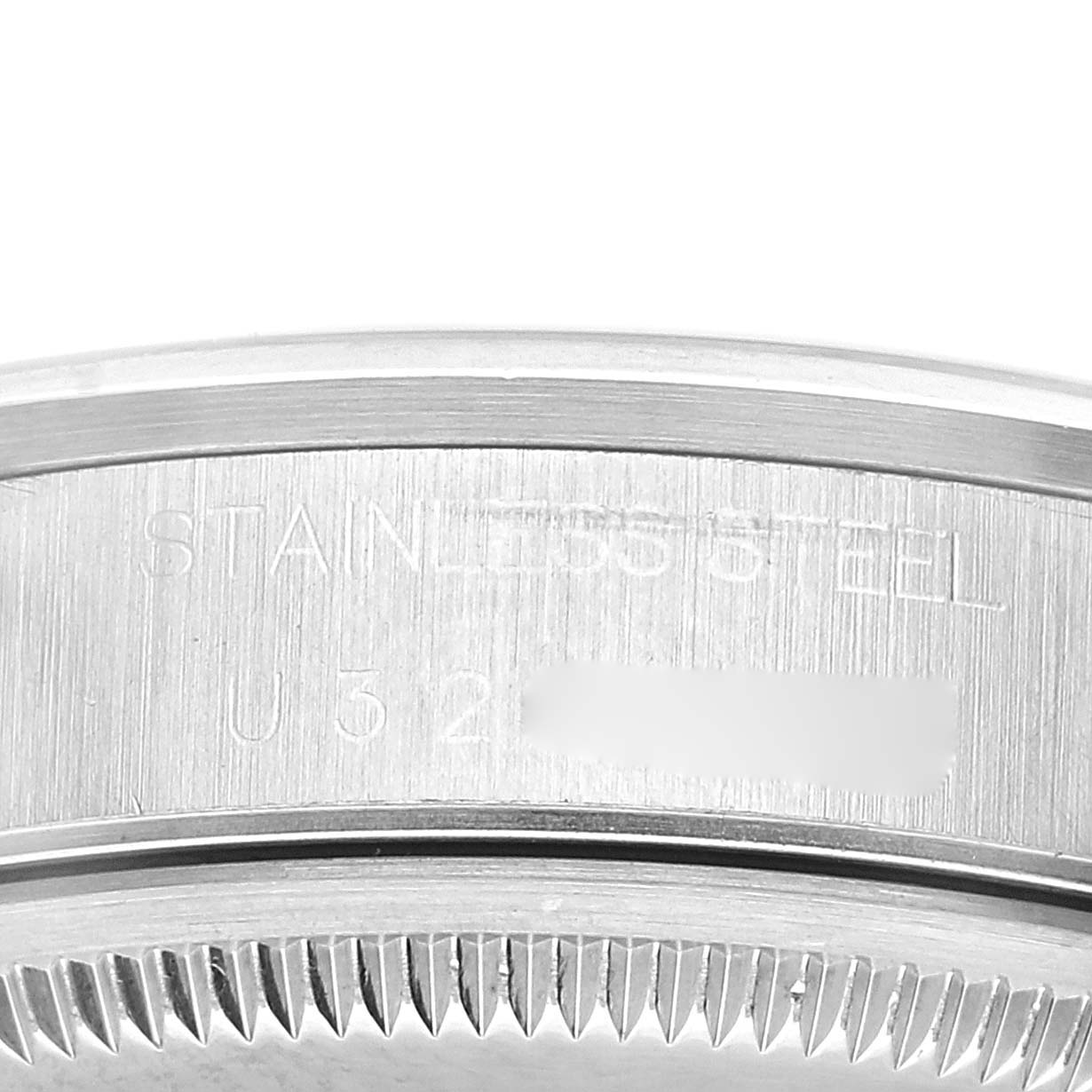 This image shows a close-up of the side of a Rolex Air-King 14000 Men's Stainless Steel Pink Dial 14000 Men's Stainless Steel Pink Dial watch, highlighting the stainless steel case and engraved serial number.