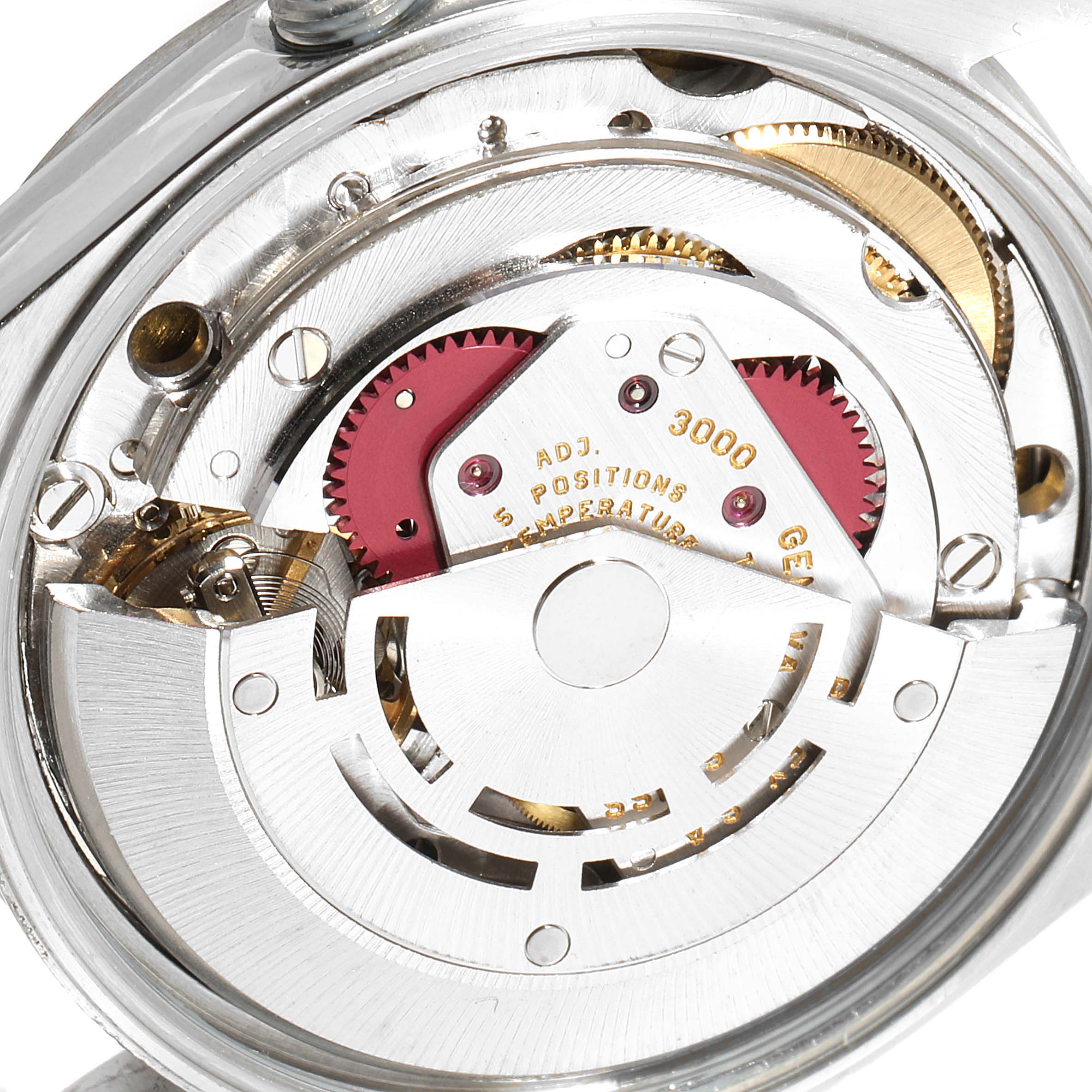 This is a close-up view of the internal mechanism of a Rolex Air-King 14000 Men's Stainless Steel White Dial 14000 Men's Stainless Steel White Dial watch, showing gears and the rotor.