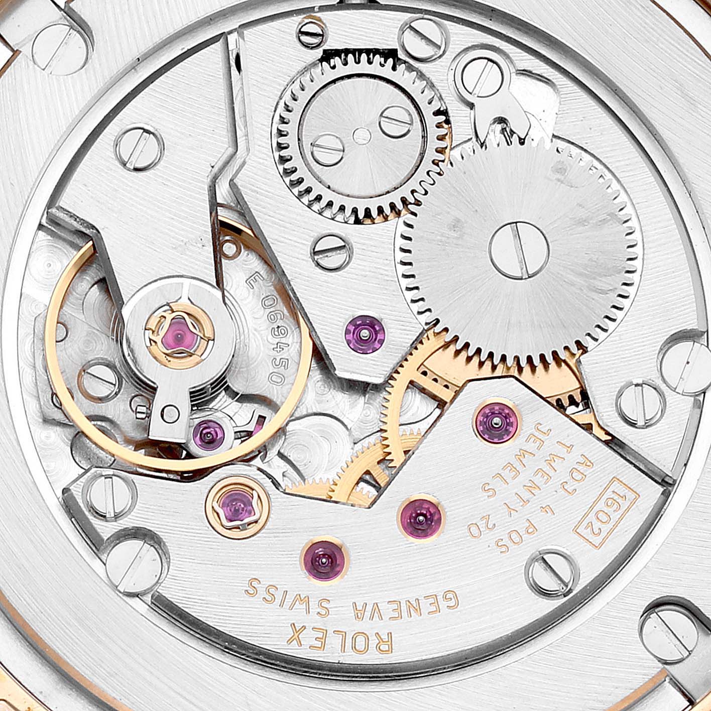 This image shows a close-up of the Rolex Cellini 5115 Men's Yellow Gold Beige Dial 5115 Men's Yellow Gold Beige Dial watch movement, highlighting gears and mechanical parts.
