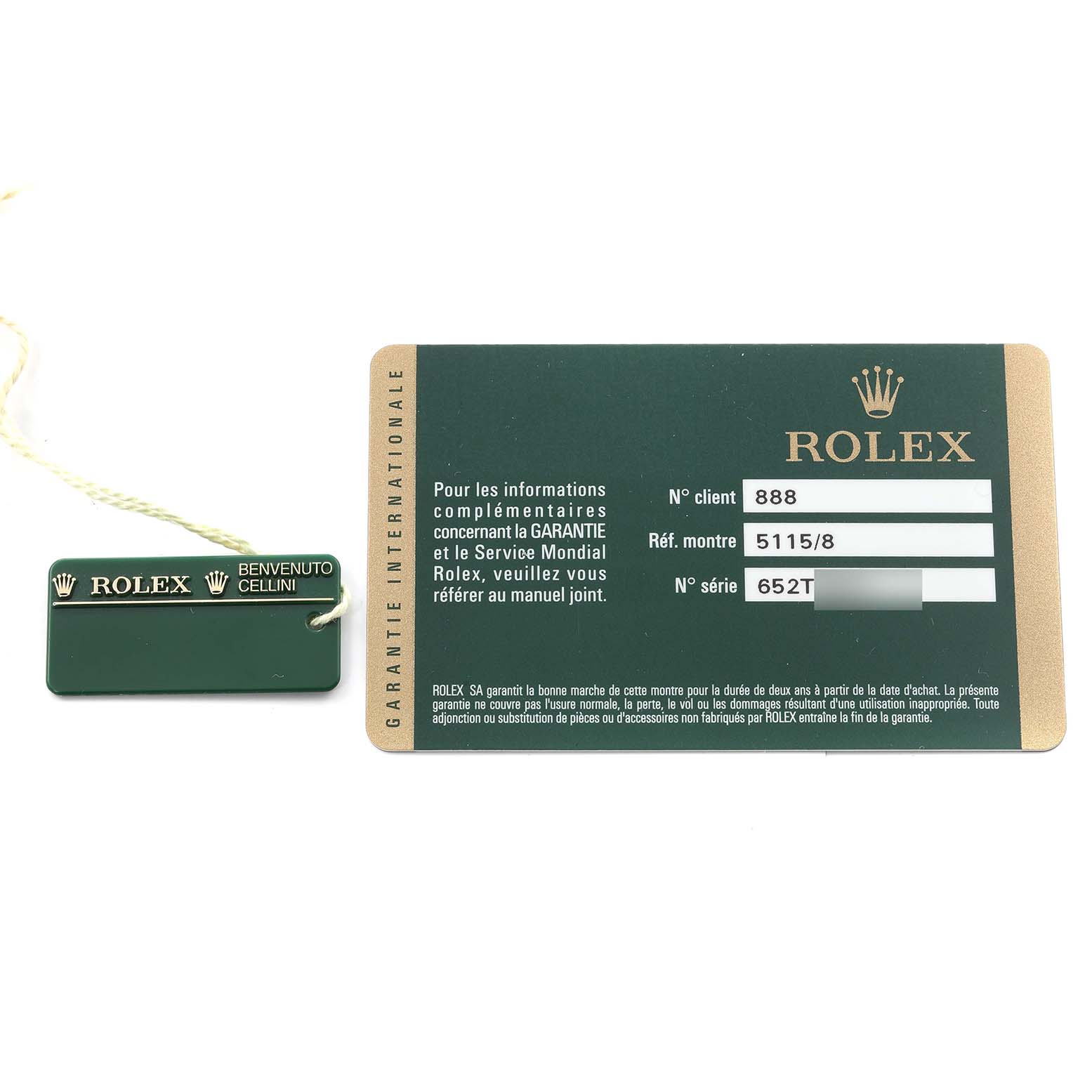 The image shows a Rolex Cellini 5115 Men's Yellow Gold Beige Dial 5115 Men's Yellow Gold Beige Dial warranty card and a green Rolex tag with a beige string.