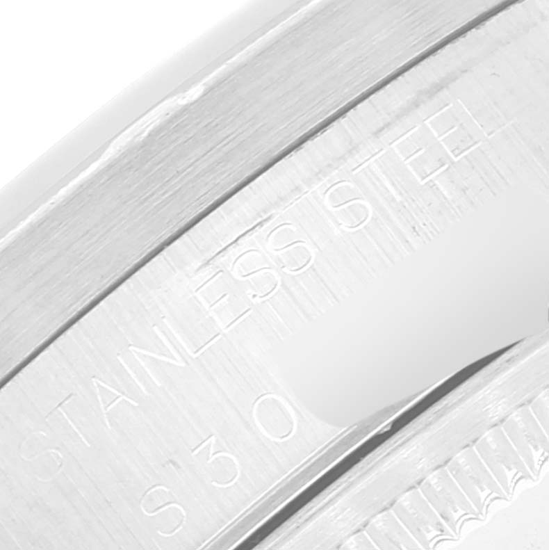 The image shows a close-up view of the stainless steel bezel with engravings of a Rolex Date 15210 Men's Stainless Steel Silver Dial 15210 Men's Stainless Steel Silver Dial model watch.