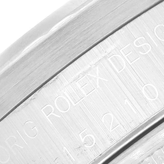 This image shows an engraved part of the casing of a Rolex Date 15210 Men's Stainless Steel Silver Dial 15210 Men's Stainless Steel Silver Dial model watch.