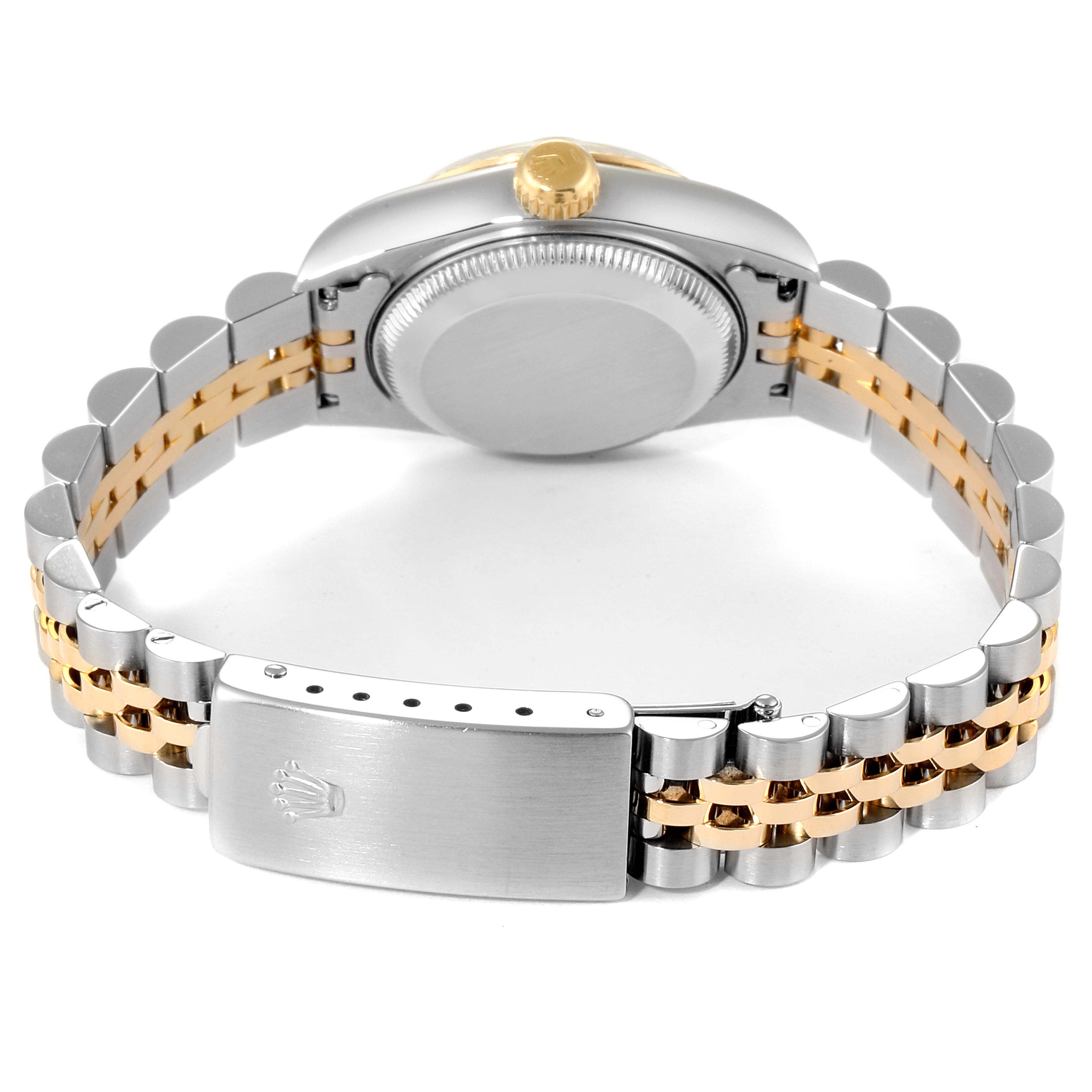 This is a rear view of the Rolex Datejust 69173 Women
s Steel and Gold (two tone) Champagne Dial 69173 Women
s Steel and Gold (two tone) Champagne Dial watch showcasing its case back, crown, and Jubilee bracelet with a clasp.