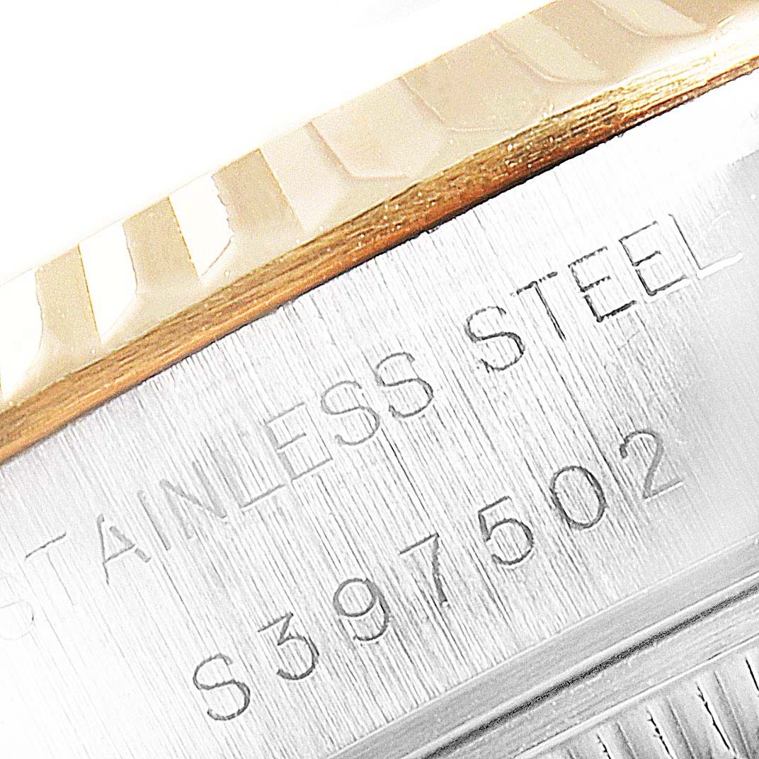 The image shows a close-up of the stainless steel back casing and serial number of a Rolex Datejust 69173 Women
s Steel and Gold (two tone) Champagne Dial 69173 Women
s Steel and Gold (two tone) Champagne Dial watch.